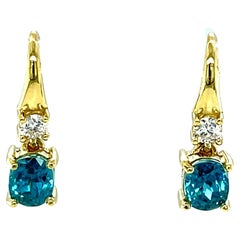 2.64 Carat Total Oval Blue Zircon and Diamond Yellow Gold Dangle Drop Earrings 