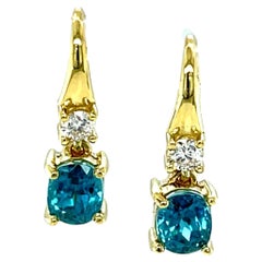 2,64 Karat Oval Blauer Zirkon und Diamant Gelbgold Tropfenohrringe