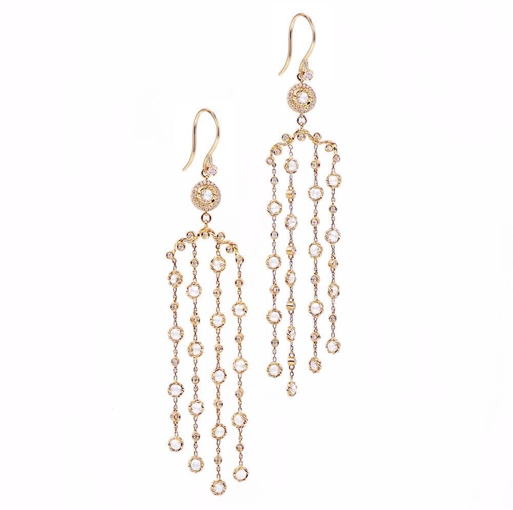 Fun and fancy at once, the shoulder dusting 4 strand Athena chandelier earrings are from JeweLyrie's Allongé collection,  featuring four long rows of delicate chain spaced with signature twist bezel set rose cut diamonds,  alternating with bezel-set