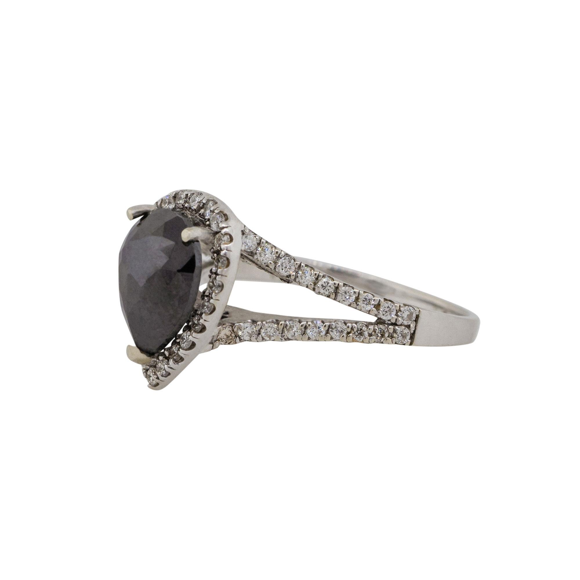 Material: 14k White gold
Diamond details: Approx. 1.97ctw pear shape cut Diamond. Diamond is Fancy Black in color and VS in clarity
                             Approx. 0.68ctw of round cut Diamonds. Diamonds are G/H in color and VS in clarity
Size: