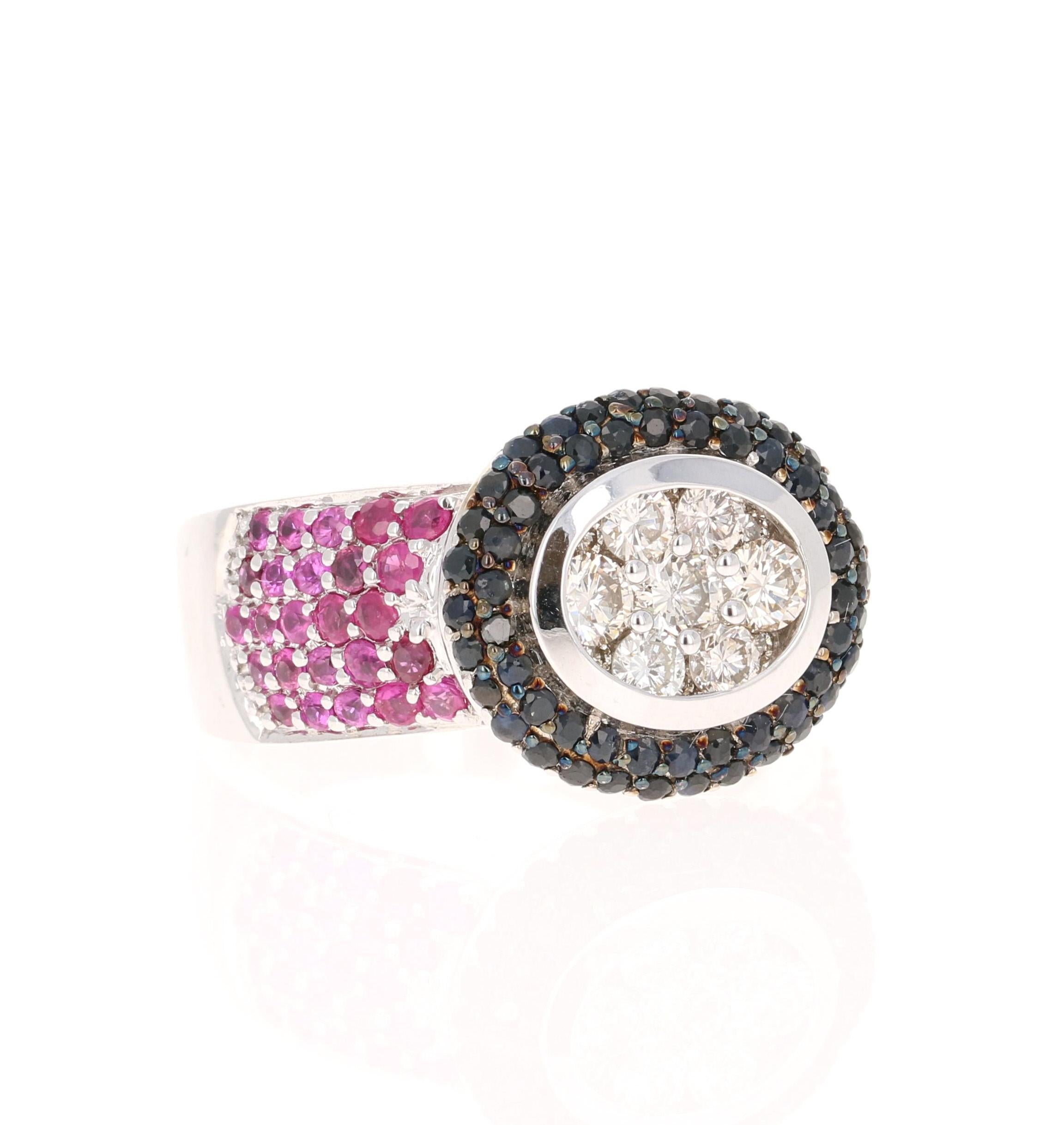This ring has 7 Round Cut Diamonds that weigh 0.65 Carats (Clarity: VS, Color: H) and 60 Black Diamonds that weigh 0.85 Carats. Furthermore there are 50 Pink Sapphires that weigh 1.15 Carats. The total carat weight of the ring is 2.65 Carats. 

It