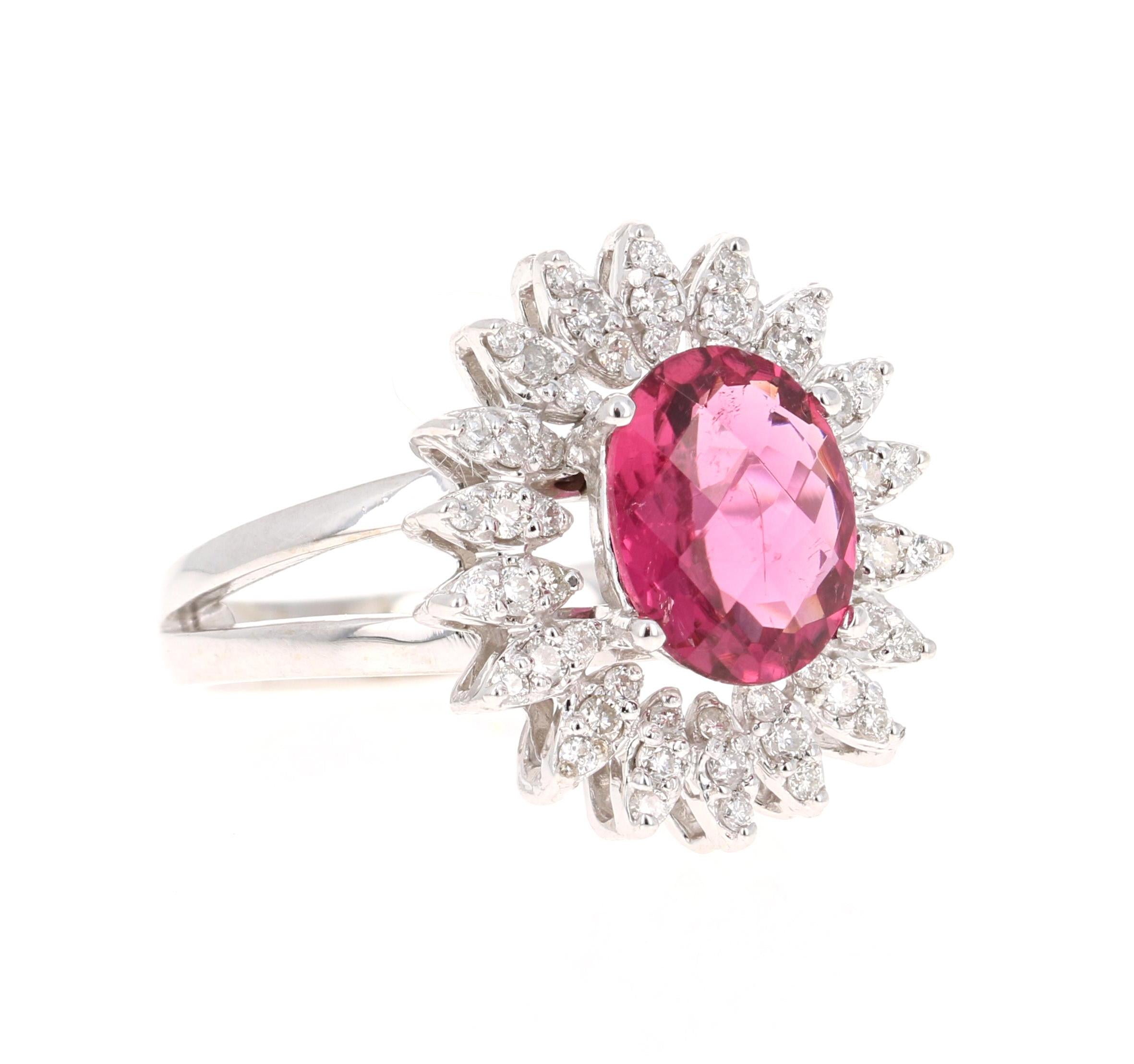 This ring has an Oval Cut Pink Tourmaline that weighs 2.05 Carats. Floating around the Tourmaline are 54 Round Cut Diamonds weighing 0.60 Carats.  The total carat weight of the ring is 2.65 Carats. The measurements of the Tourmaline are 8mm x 10mm.