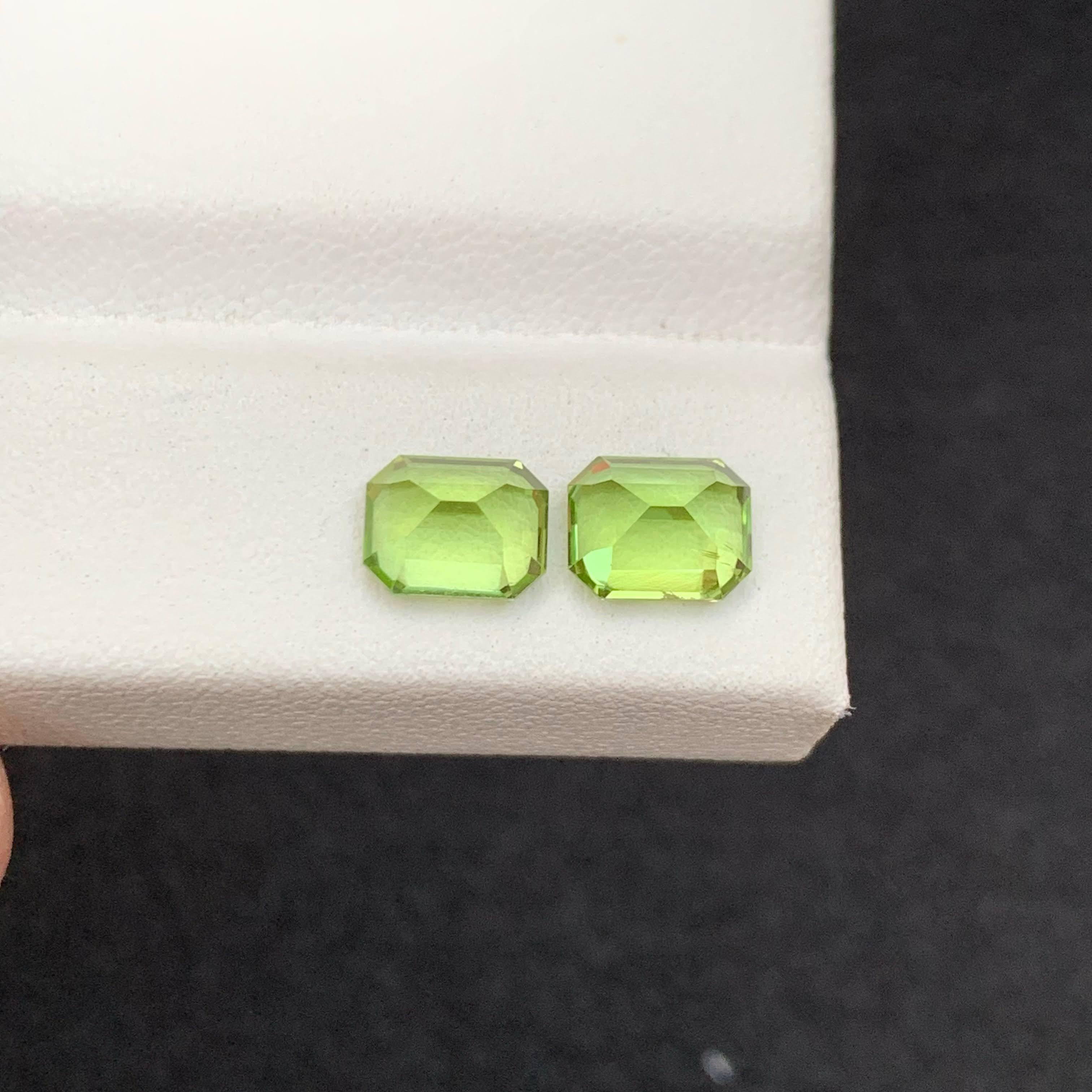 Modern 2.65 Carat Natural Loose Green Peridot Pair Emerald Cut Pakistani Gemstone For Sale