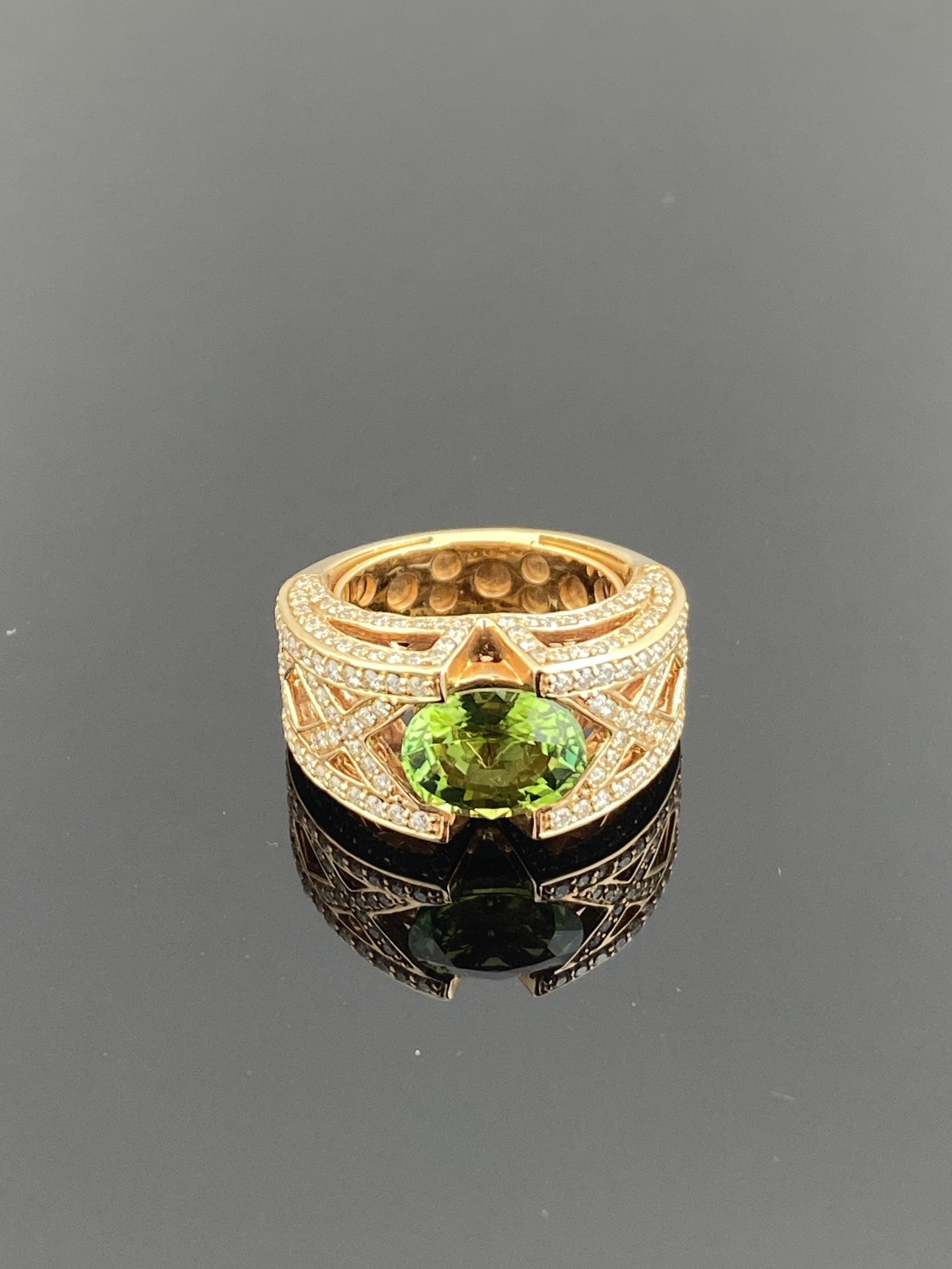 An absolutely gorgeous ring featuring a 2.65 Carat, Natural Tsavorite Garnet and 1.27 Carats of Diamond Accents set in 13.5 Grams of 18K Rose Gold. Garnets have been adorned by humans throughout history from Ancient Egypt, Rome and Greece. They come