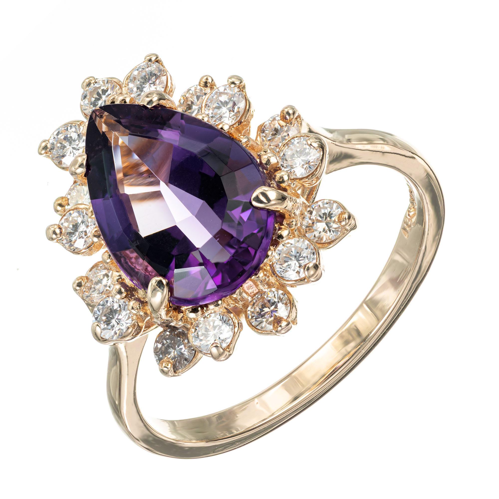 Amethyst and diamond ring. Pear shaped natural Amethyst with a halo of 16 full cut diamonds in a 14k yellow gold setting. 

1 Pear shaped natural gem purple Amethyst, approx. total weight 2.65cts, 12 x 8mm
16 full cut diamonds, approx. total weight