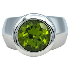 2.65 Carat Round Cut Bezel Set Peridot Wide Band Ring in 14 Karat White Gold