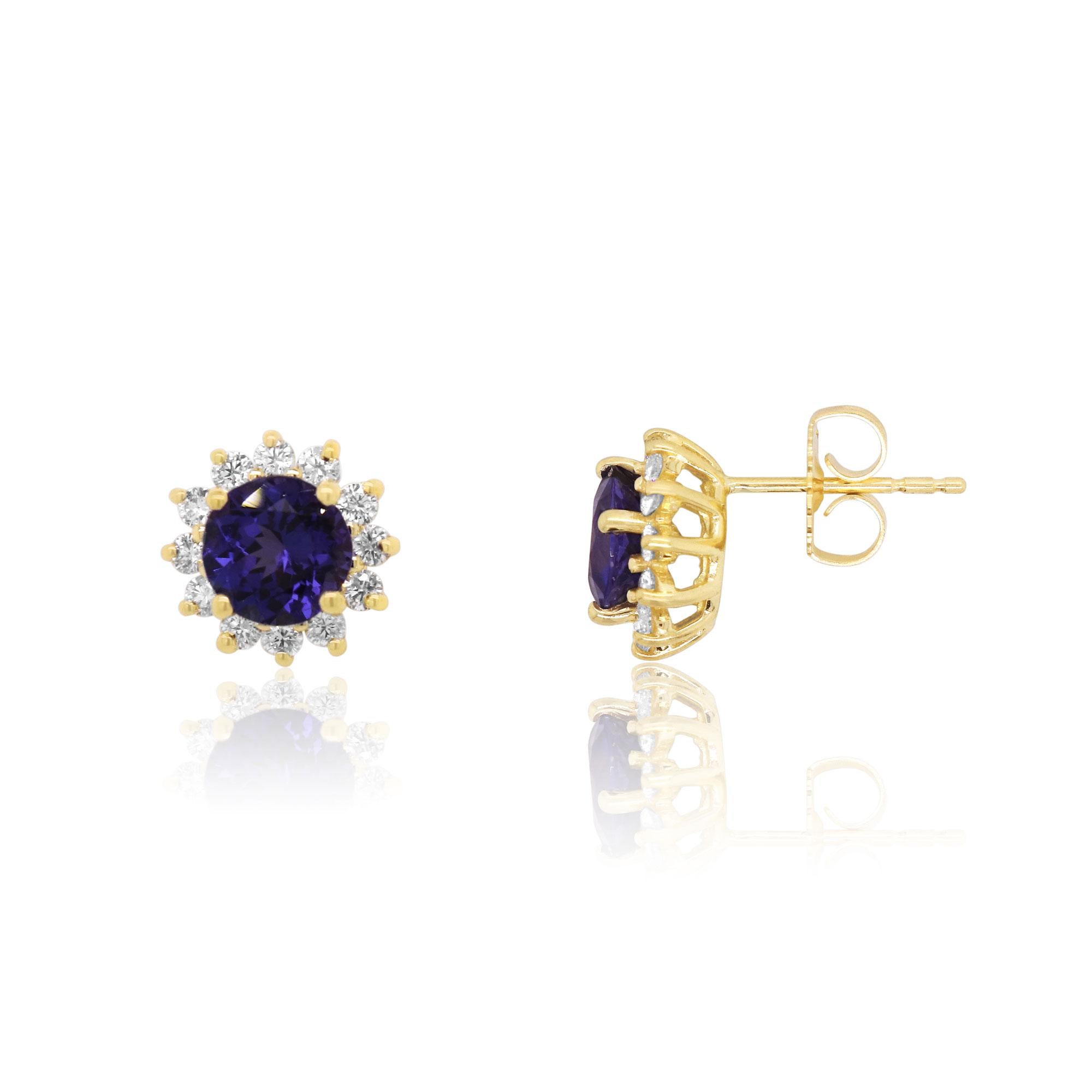 Material: 14k Yellow Gold 
Stone Details: 2 Round Shape Tanzanites at 2.65 Carats Total Weight
24 Round Brilliant White Diamonds at 0.65 Carats. Clarity: SI / Color: H-I

Fine one-of-a kind craftsmanship meets incredible quality in this breathtaking
