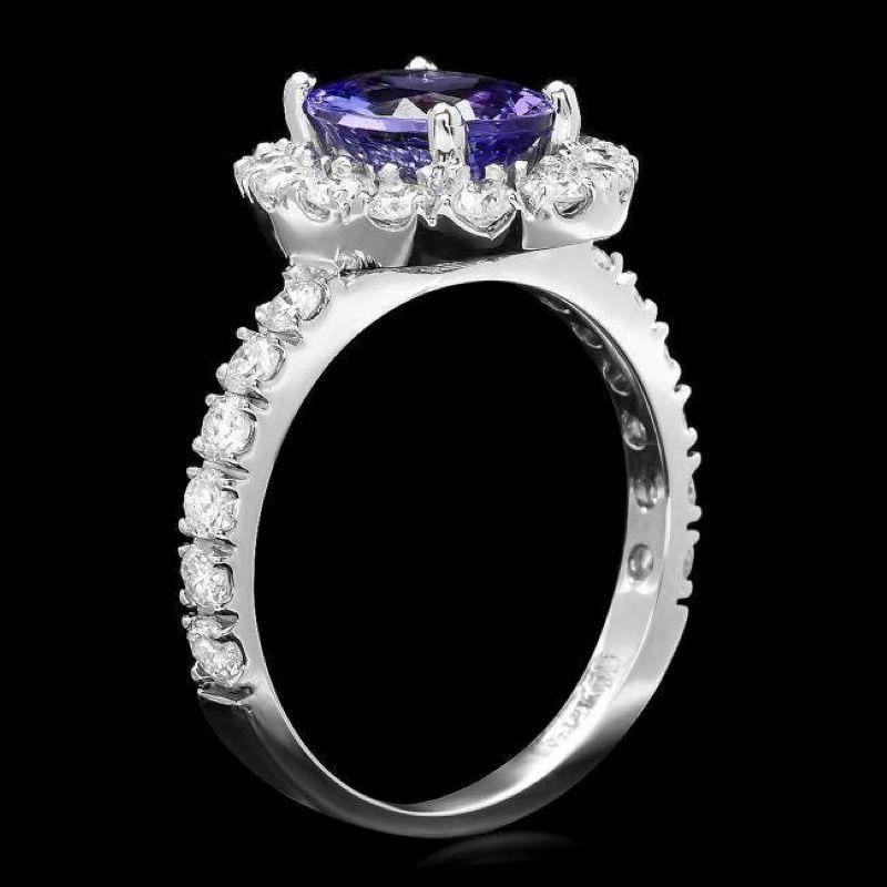 2.65 Carats Natural Very Nice Looking Tanzanite and Diamond 14K Solid White Gold Ring

Total Natural Oval Cut Tanzanite Weight is: Approx. 1.75 Carats 

Tanzanite Measures: Approx. 9.00 x 7.00mm

Natural Round Diamonds Weight: Approx. 0.90 Carats