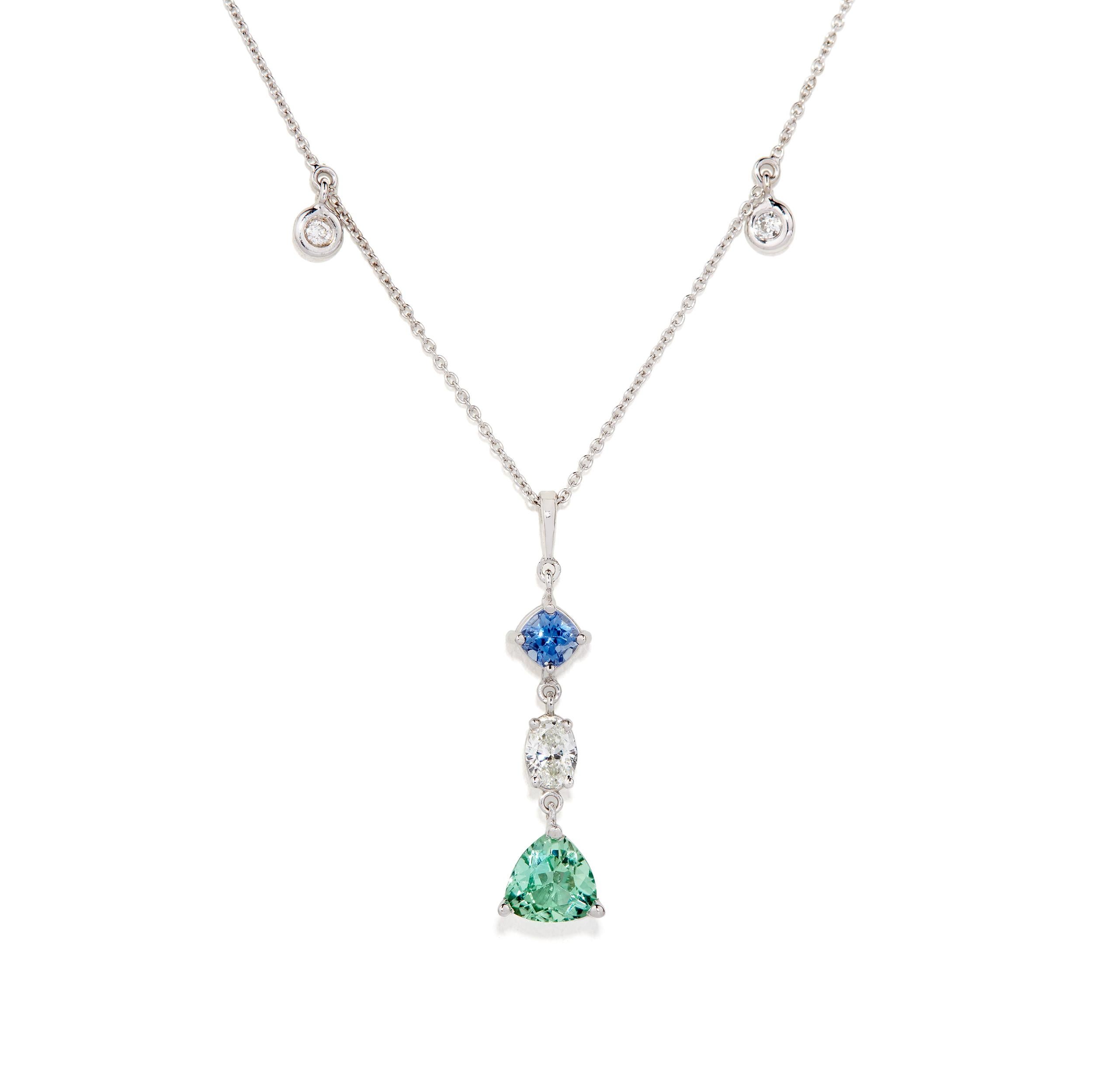 This necklace was designed alongside a coordinating set of earrings that can be found listed separately.

Necklace Details:

Trillion-shaped Tourmaline Weight:  1.07 Carats
Oval-shaped Diamond Weight:  0.43 Carats
Cushion Cut Sapphire:  0.49