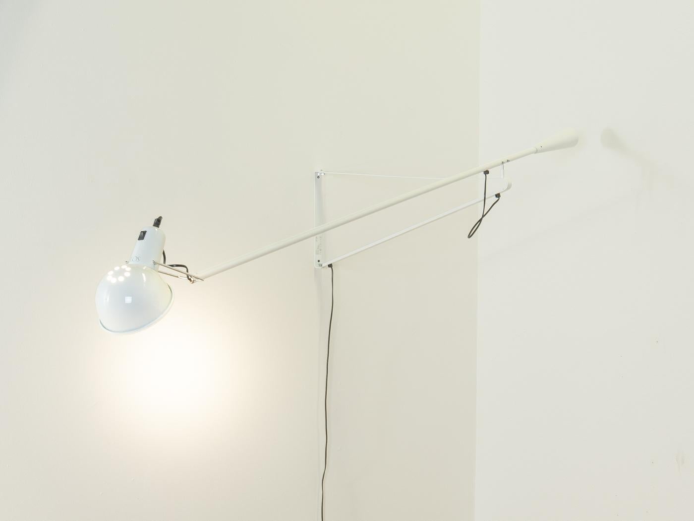 
Article Details
265 wall lamp by Paolo Rizzatto for Flos. Draft from 1973. Reflector and adjustable arm in liquid-painted steel, chrome-plated brass reflector bracket, cast iron conical counterweight and wall mounting in liquid-painted