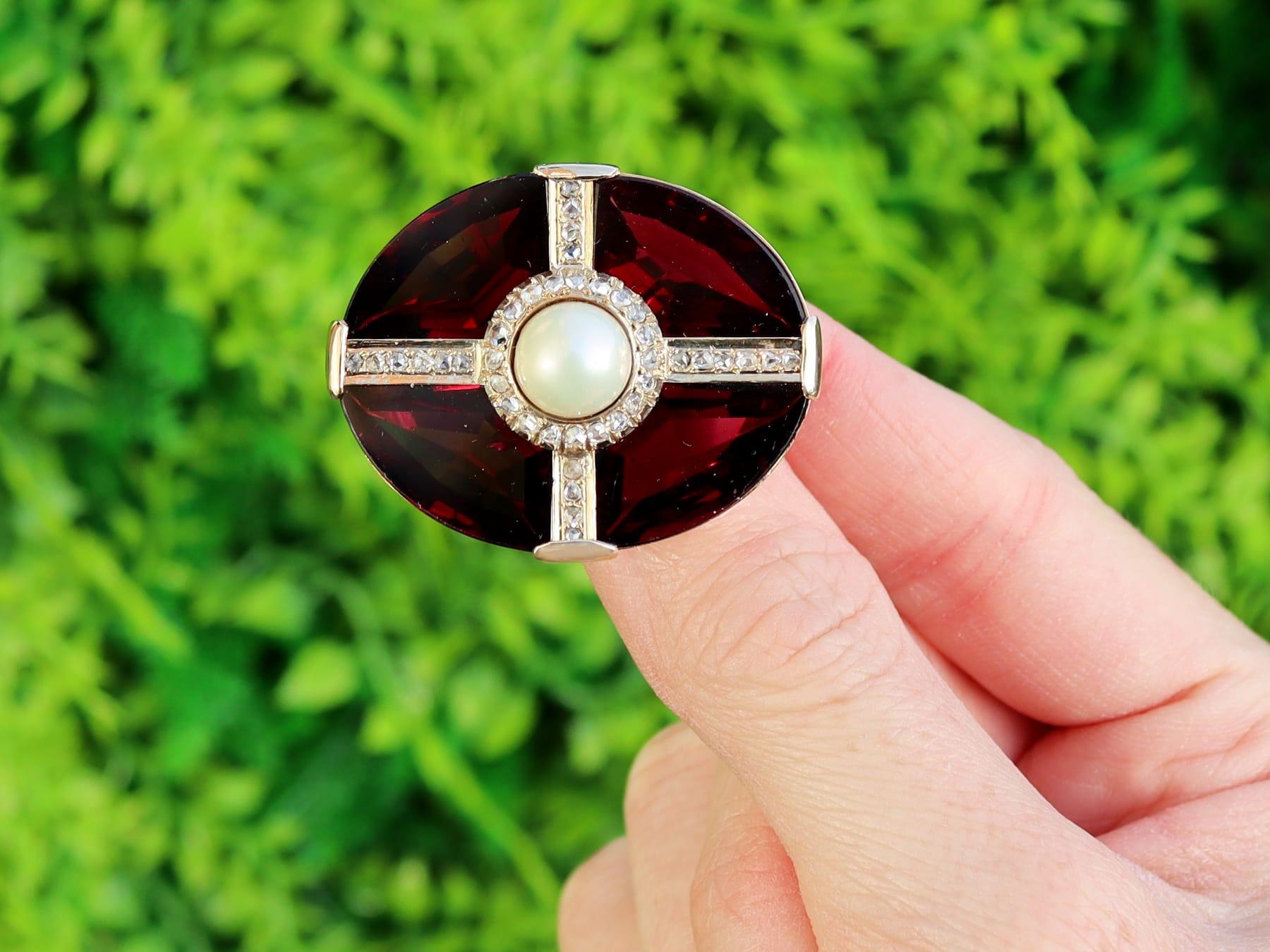 A stunning, fine and impressive antique 26.52 carat garnet, 1.23 carat diamond, pearl and 15 karat yellow gold jewellery set; part of our diverse antique jewellery and estate jewelry collections.

This stunning, fine and impressive antique garnet