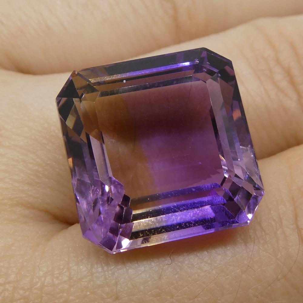 Description:

Gem Type: Ametrine
Number of Stones: 1
Weight: 26.55 cts
Measurements: 17.40x17.10x11 mm
Shape: Square
Cutting Style Crown: Step Cut
Cutting Style Pavilion: Step Cut
Transparency: Transparent
Clarity: Very Slightly Included: Eye Clean