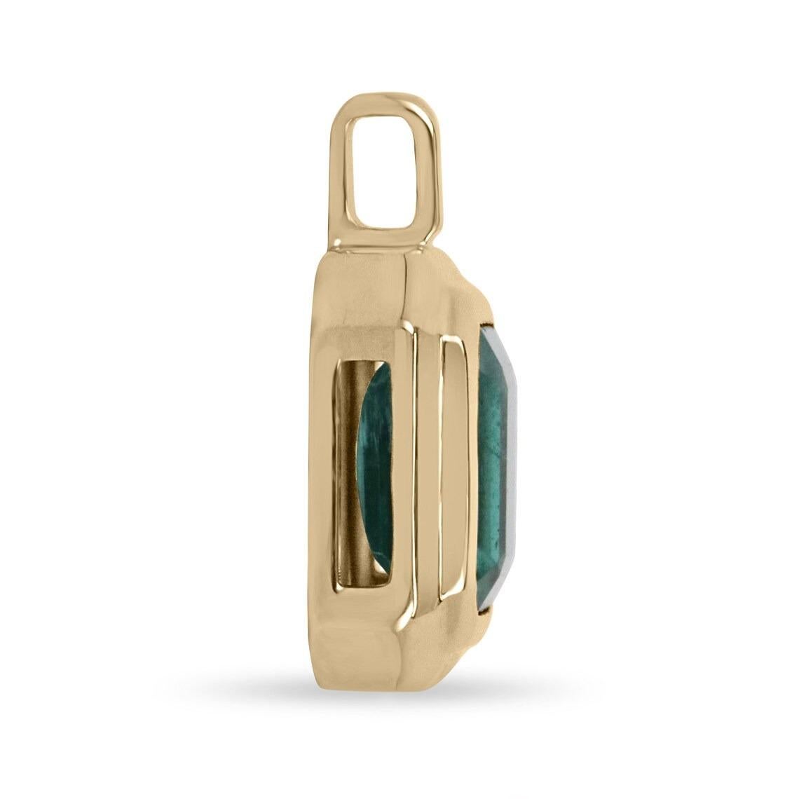 A bold 2.65-carat natural emerald solitaire, double bezel solid 14K hand-crafted pendant. This is quite an alluring piece with an incredible emerald as the center of attention. The clarity of the stone is absolutely incredible, with very minor