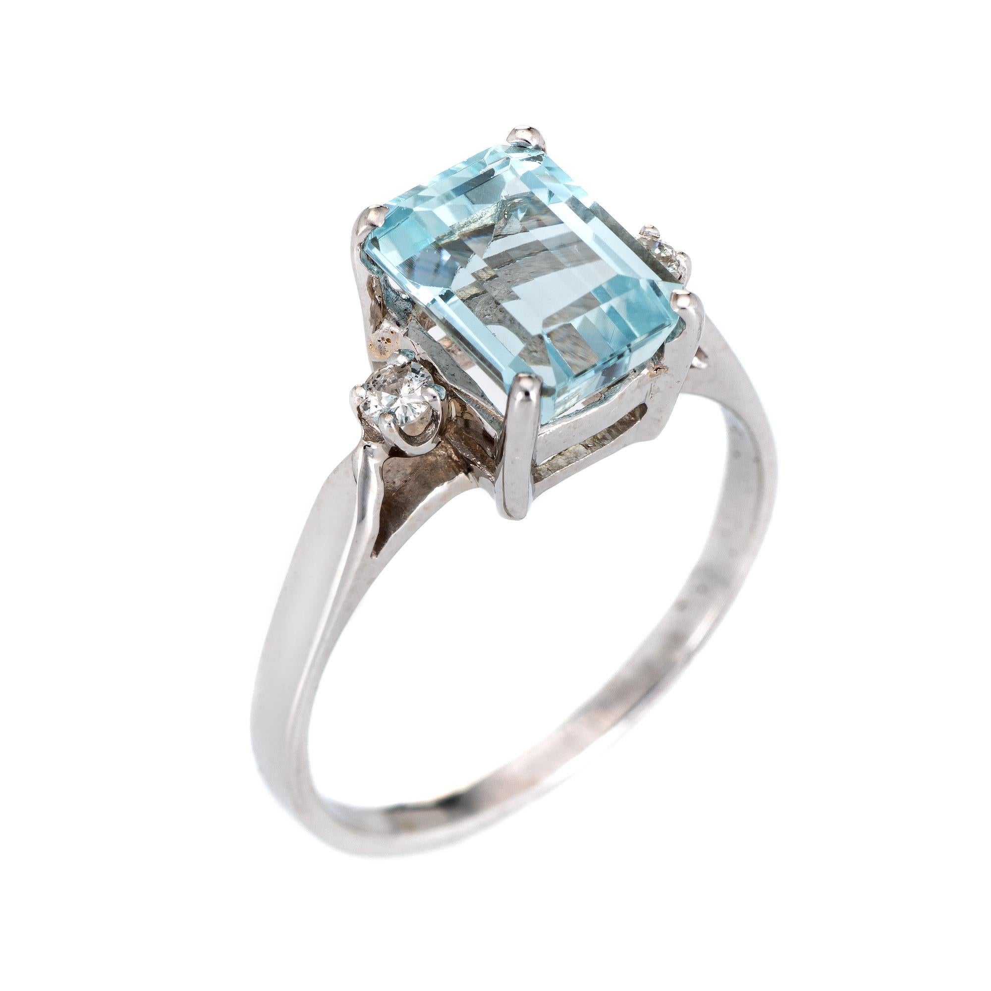 Stylish aquamarine & diamond ring crafted in 14 karat white gold. 

Emerald cut aquamarine measures 8.5mm x 6.5mm (estimated at 2.65 carats), accented with an estimated 0.04 carats of diamonds (estimated at H-I color and SI1-2 clarity). The