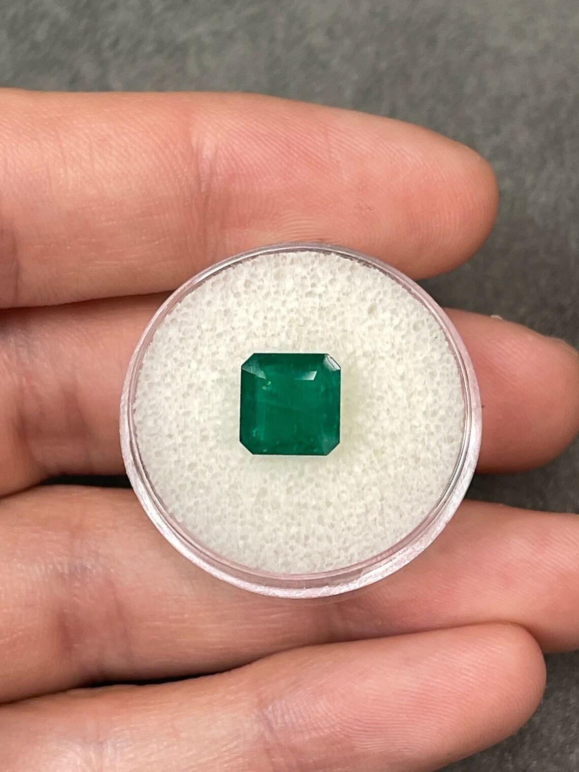 Stone: Emerald
Weight: 2.65-carats
Shape: Asscher Cut
Clarity: Transparent
Luster: Very Good
Color: Vivid Dark Green
Measurements: 8.2mm x 8.05mm
Geographic Origin: Brazil
Treatment: Natural, Oiling

Comments: Due to their growth conditions in
