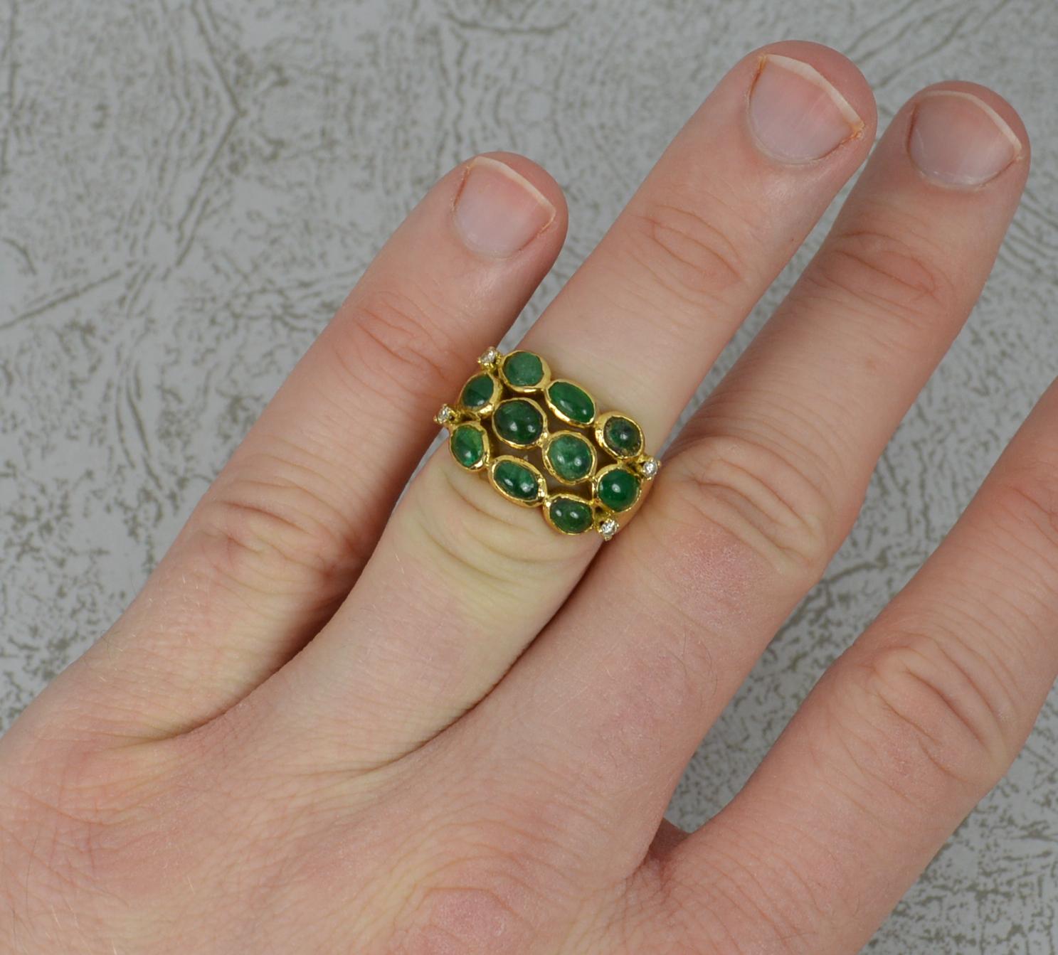 A superb vintage cluster ring.
Solid 18 carat yellow gold example.
Set with ten natural round and oval shaped emerald cabochon stones with four small diamonds. 2.65 carats of emerald in total.
20mm x 13mm cluster head.

CONDITION ; Good for age.