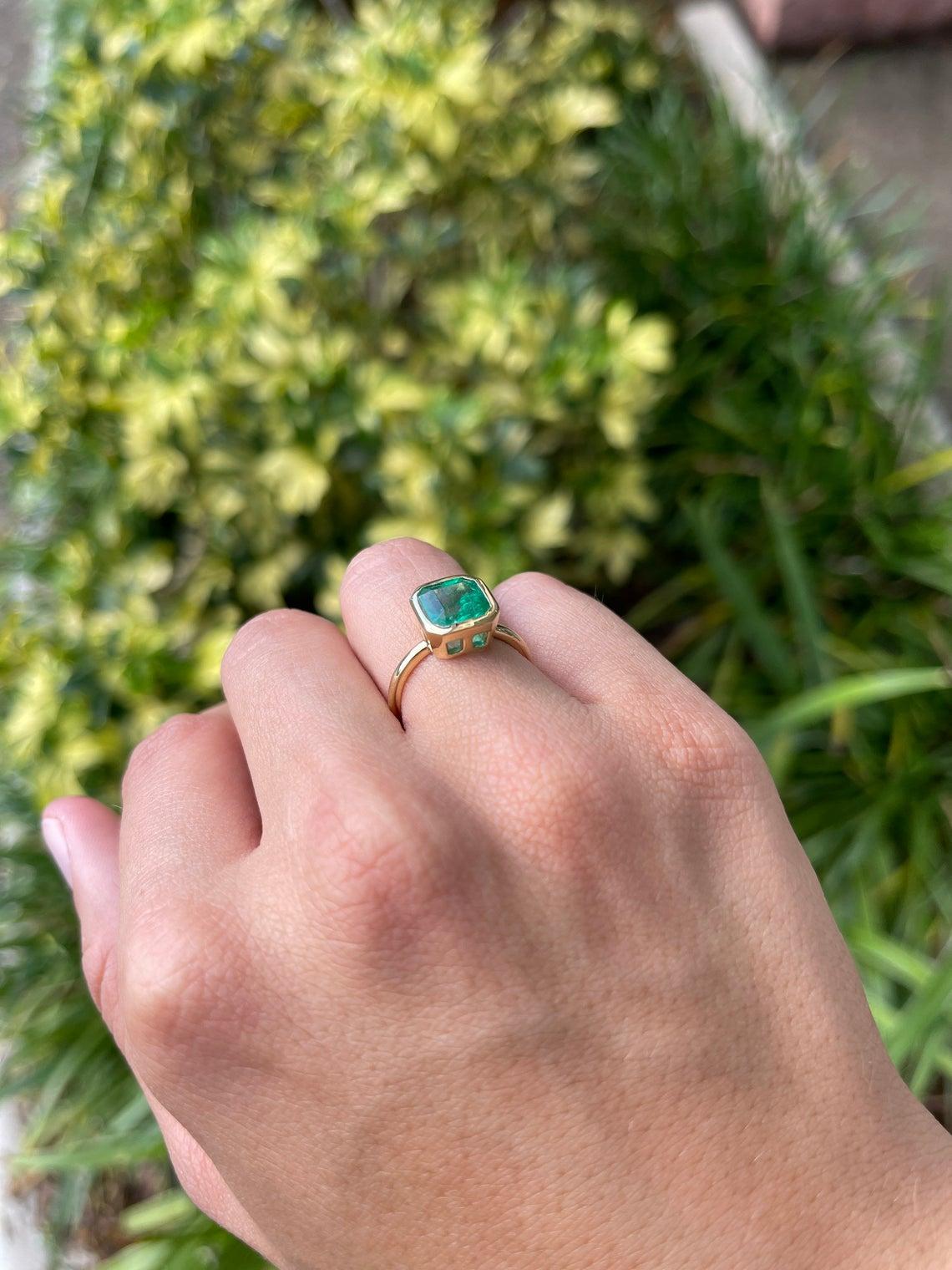 bezel emerald ring