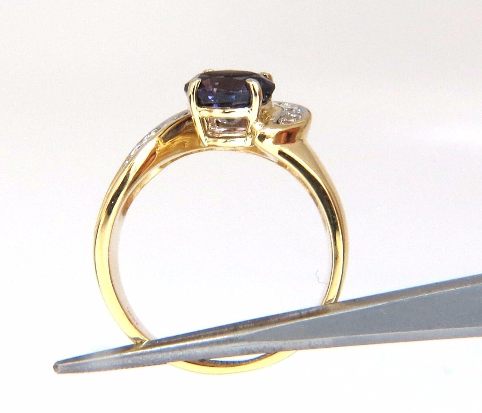 2.26ct. Natural Purple Spinel diamond ring

8 x 7.8mm

Round, Brilliant cut

Transparent / Vivid Purple color & clean clarity.

.40ct Round, full cut diamonds:

G color, vs-2 clarity.

14kt. yellow gold.

9.3 Grams

Ring .50 inch wide.

Depth of