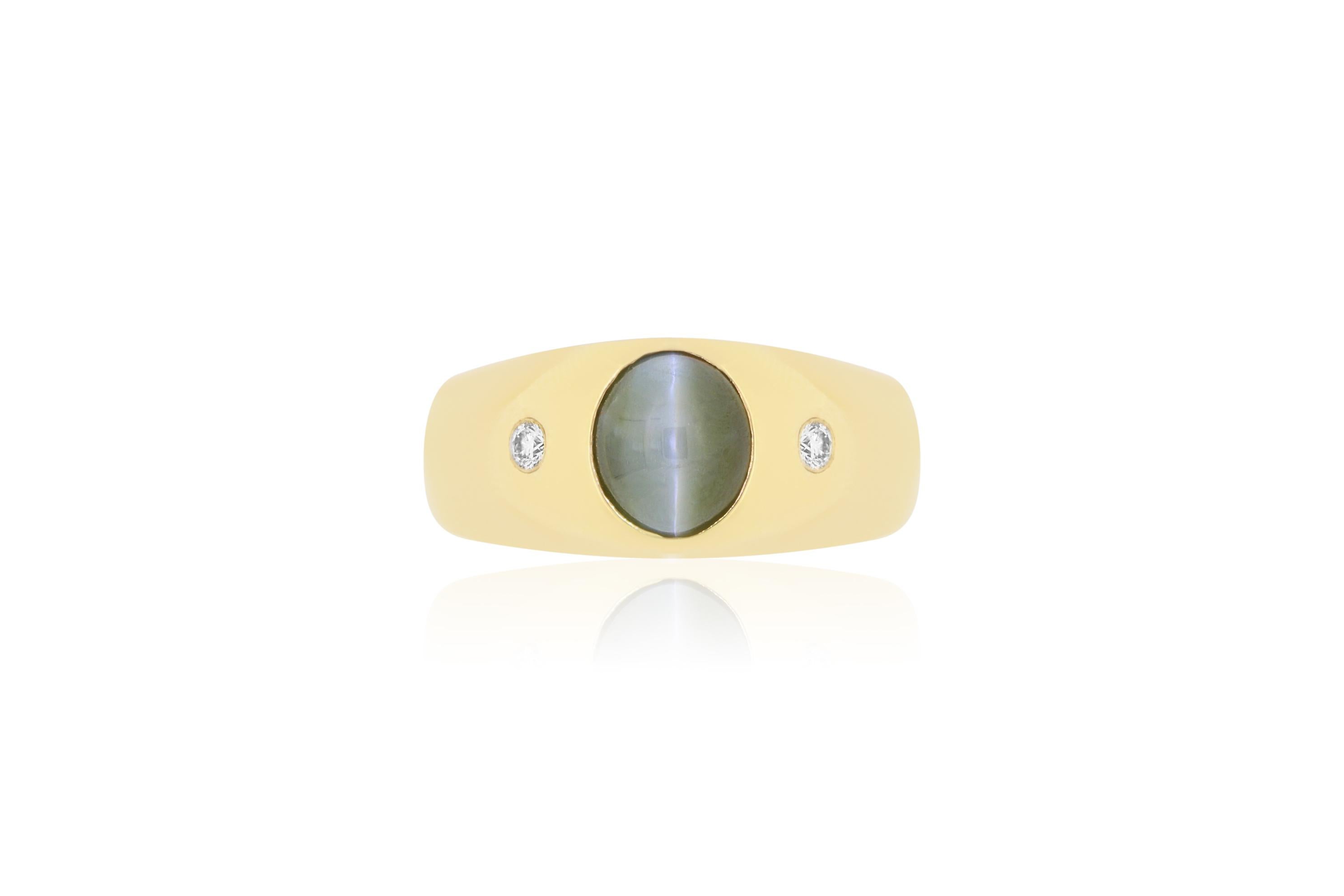 This unique oval 2.66 carat Chrysoberyl Cats Eye is set in a 14k Yellow Gold with 2 accent white diamonds. This sleek modern setting accentuates the alluring and unique Cats Eye stone.

Material: 14k Yellow Gold
Colored Diamond: 1 Oval Cut