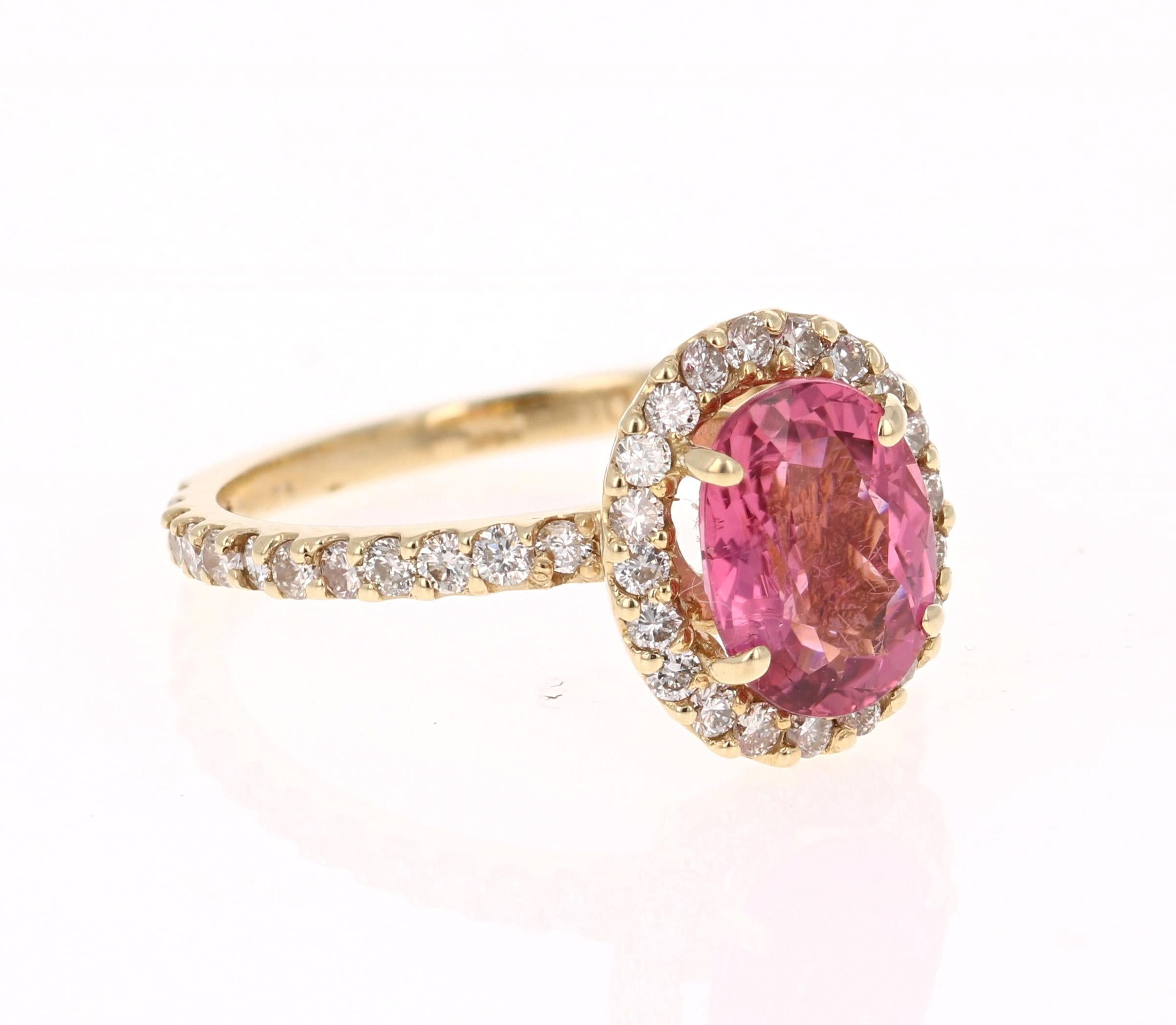 This ring has a gorgeous Oval Cut Pink Tourmaline that weighs 1.93 Carats. Floating around the tourmaline is a simple halo of 44 Round Cut Diamonds that weigh 0.73 Carats. The total carat weight of the ring is 2.66 Carats. 

The tourmaline is 9 mm x