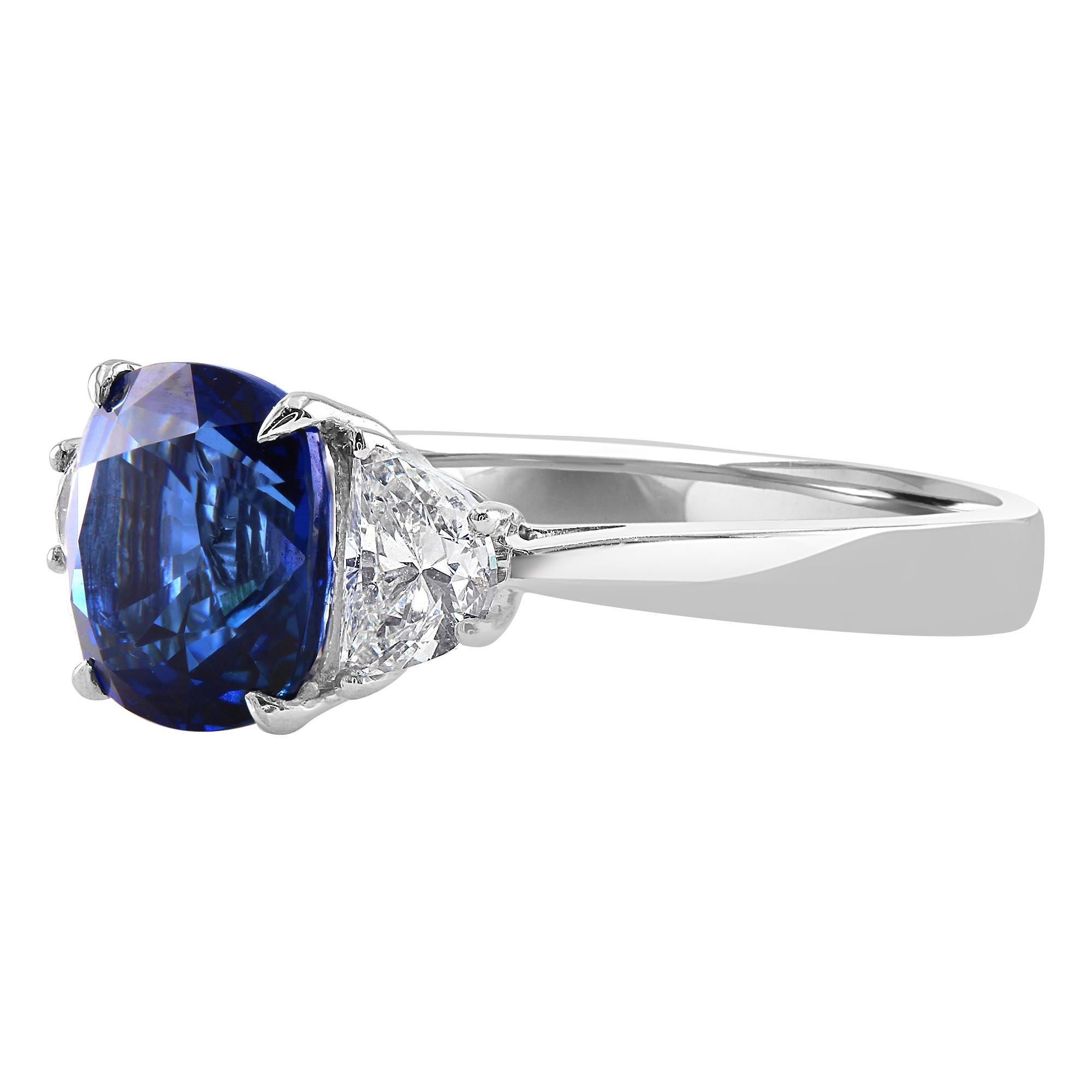 This beautiful ring features a 2.66 carat cushion blue sapphire, set between two half moons, 0.55 carat total weight. 

Introducing a gorgeous colored gemstone engagement ring that will surely be a one of a kind look for any lucky lady. If you are