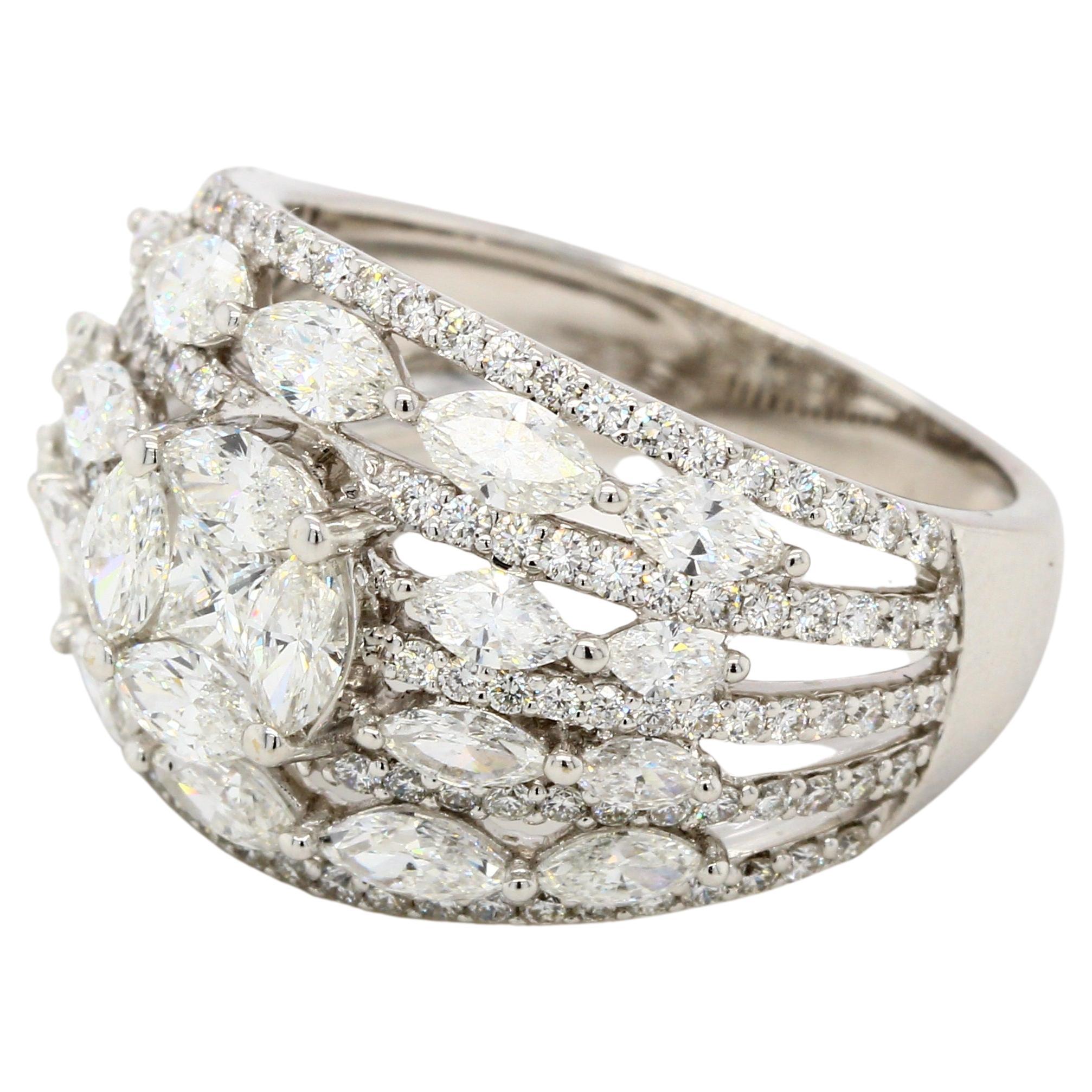 Illusion wedding band with 2.66 carats of diamonds. The ring is set with diamond round 0.72 carats, diamond marquise 1.80 carats, and diamond princess 0.14 carats, and it creates an illusion in the center to give it a one-piece look, making it very