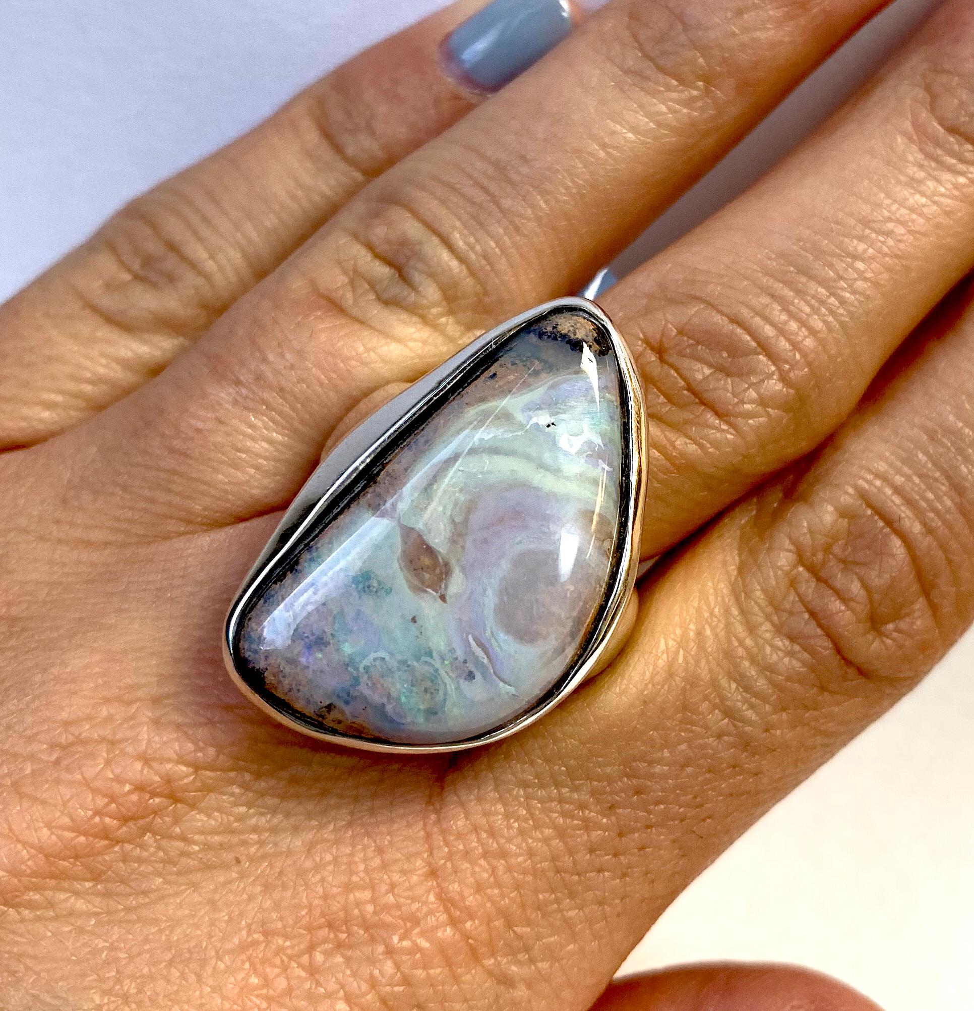 This beautiful 26.60 Carat Oval shaped Opal is set with an intricate design for a clean and classy look.

Material: Silver
Gemstone: 1 Oval Opal at 26.60 Carats.
Ring Size: 6.5. Alberto offers complimentary sizing on all rings.

Fine one-of-a-kind