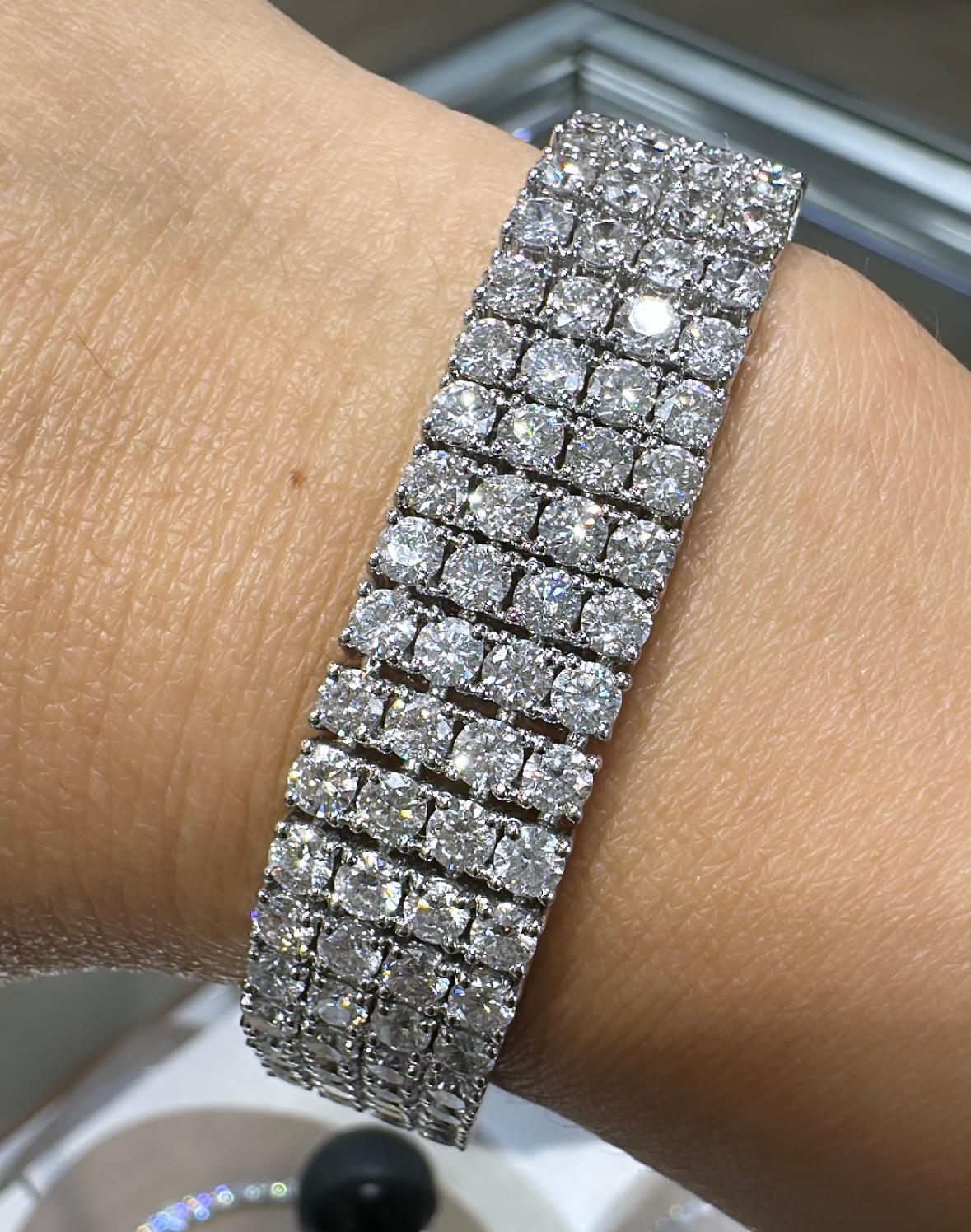 SKU: 103106
Dramatic 26.65 carat white diamond bangle bracelet sure to add shimmer and shine. With 200 total number of round diamonds your wrist will shine with every move that you make. Bracelet width: 13.3mm and fits a 3 inch wrist
Metal: 18k