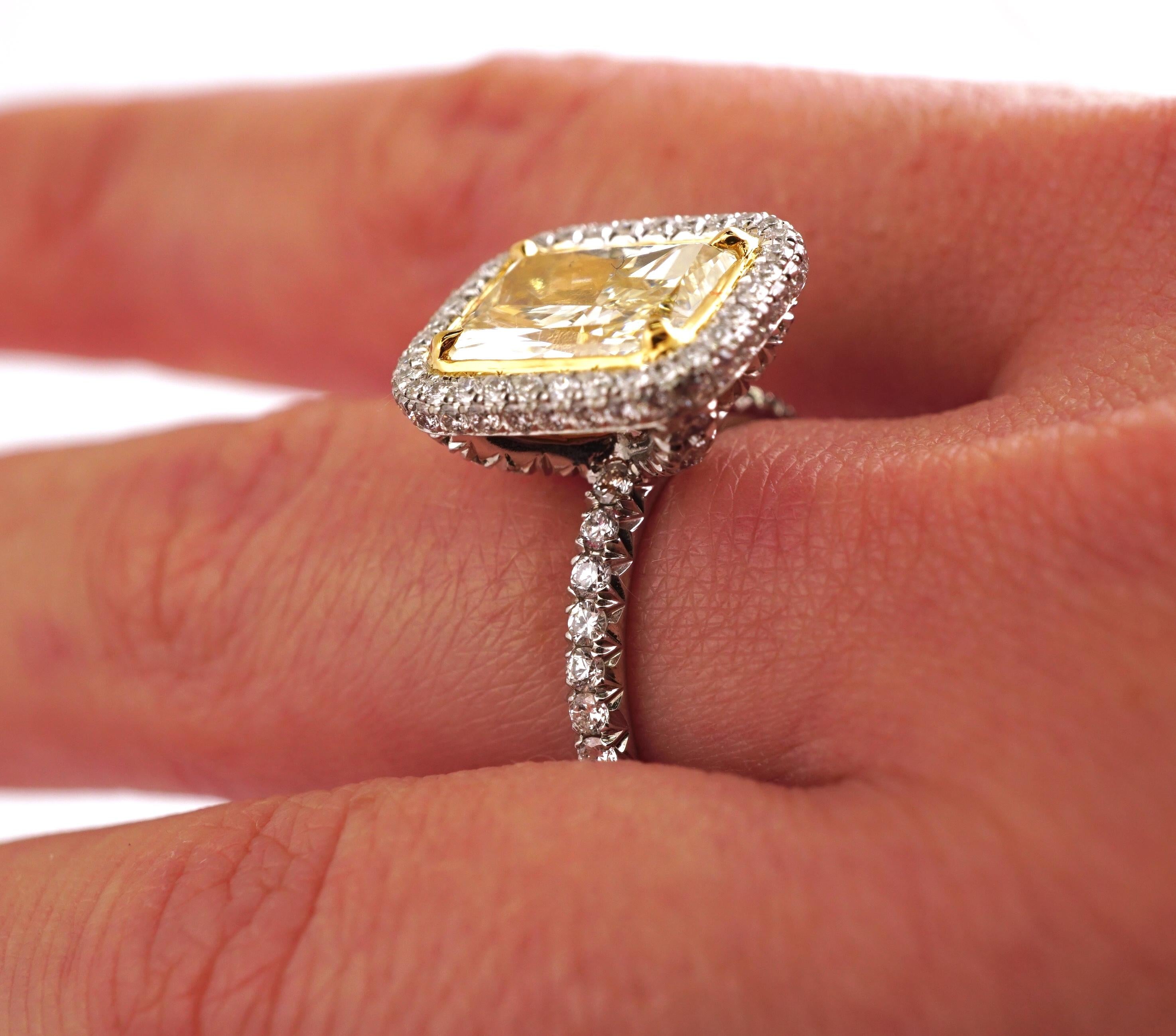 Contemporary 2.55 Carat Fancy Yellow Radiant Cut Diamond Engagement Ring in Platinum