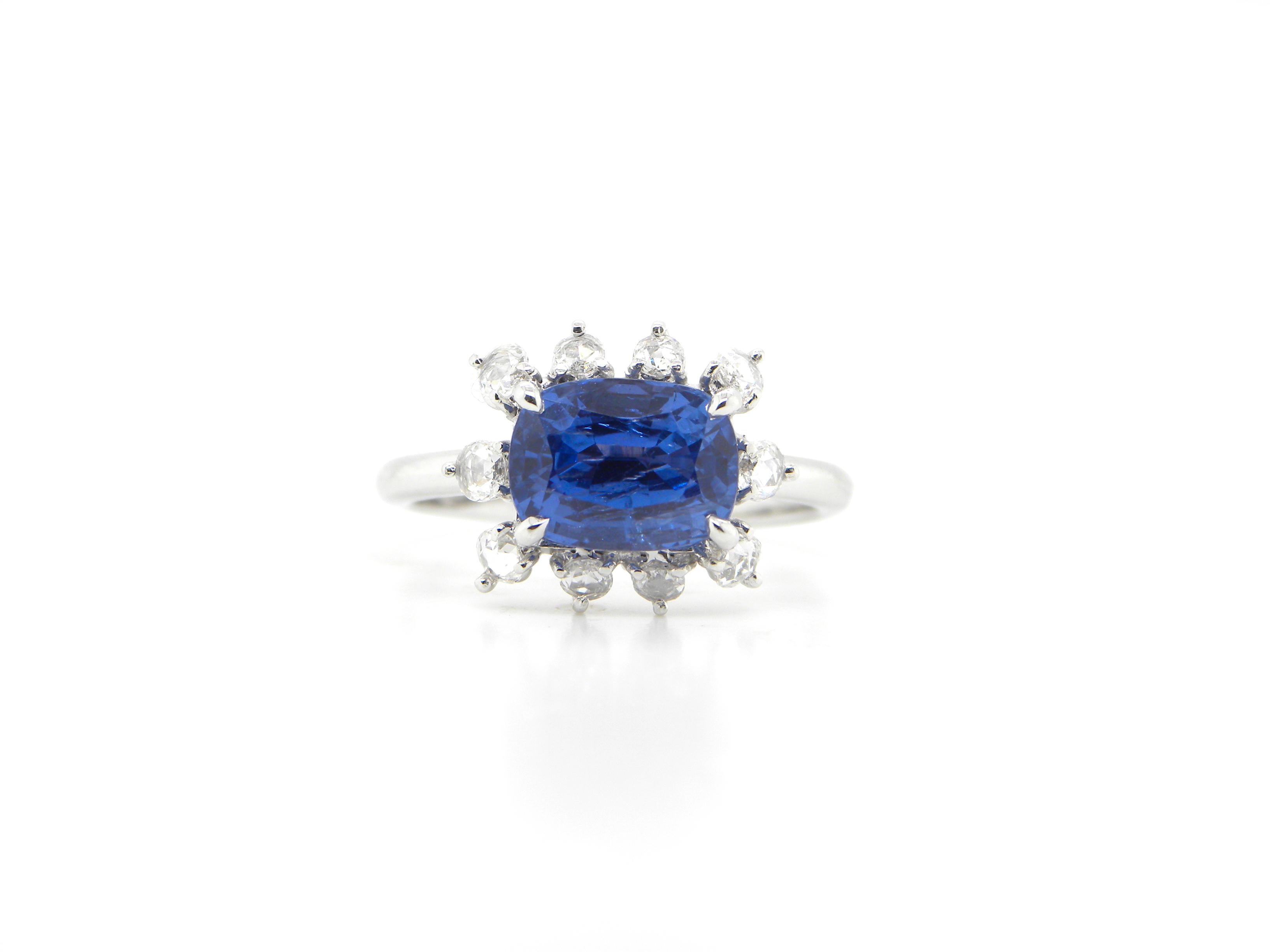2.67 Carat GIA Certified Unheated Burmese Sapphire and Diamond Engagement Ring:

An elegant ring, it features a gorgeous GIA certified cushion-cut unheated Burmese blue sapphire weighing 2.67 carat, surrounded by a halo of super-white rose cut