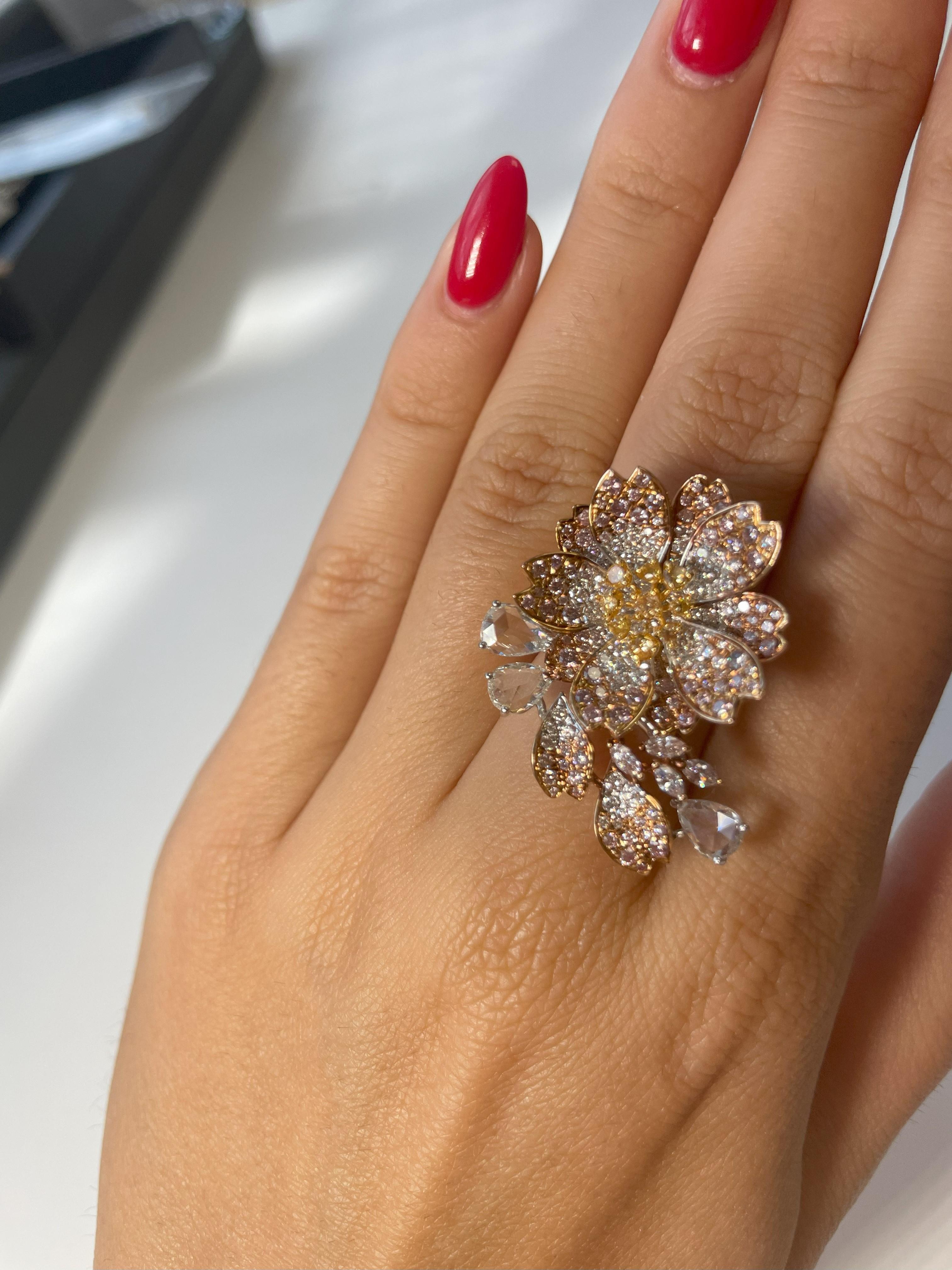 This exquisite Art Nouveau-inspired masterpiece, featuring a stunning 0.91 Carat Pink Diamond in Marquise and Round Brilliant cuts, accompanied by a 0.24 Carat Yellow Diamond and embellished with 1.54 Carats of colorless diamonds. This enchanting