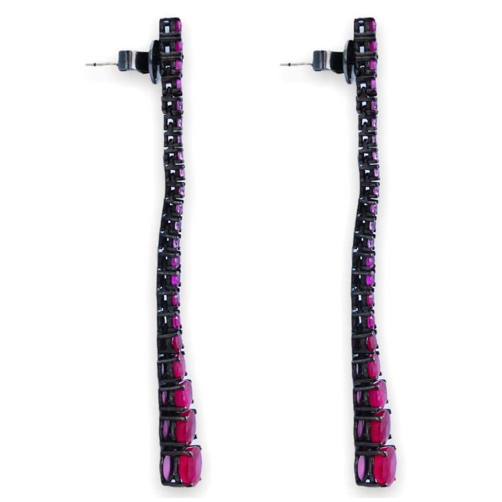 Minimalism at its finest - pure Elegance, with a European twist.

Rubies 2.67cts
Pink Sapphires .70cts
18K White Gold
Black Rhodium Plating

Earring Dimensions: 66.675mm (L) x 1.5875mm - 3.175mm (W) x 3.175mm - 4.7625mm (H)

Disclaimer:
Lighting and