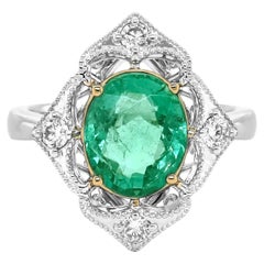 Anillo de oro blanco y amarillo con esmeralda y diamante blanco de 2.67 quilates