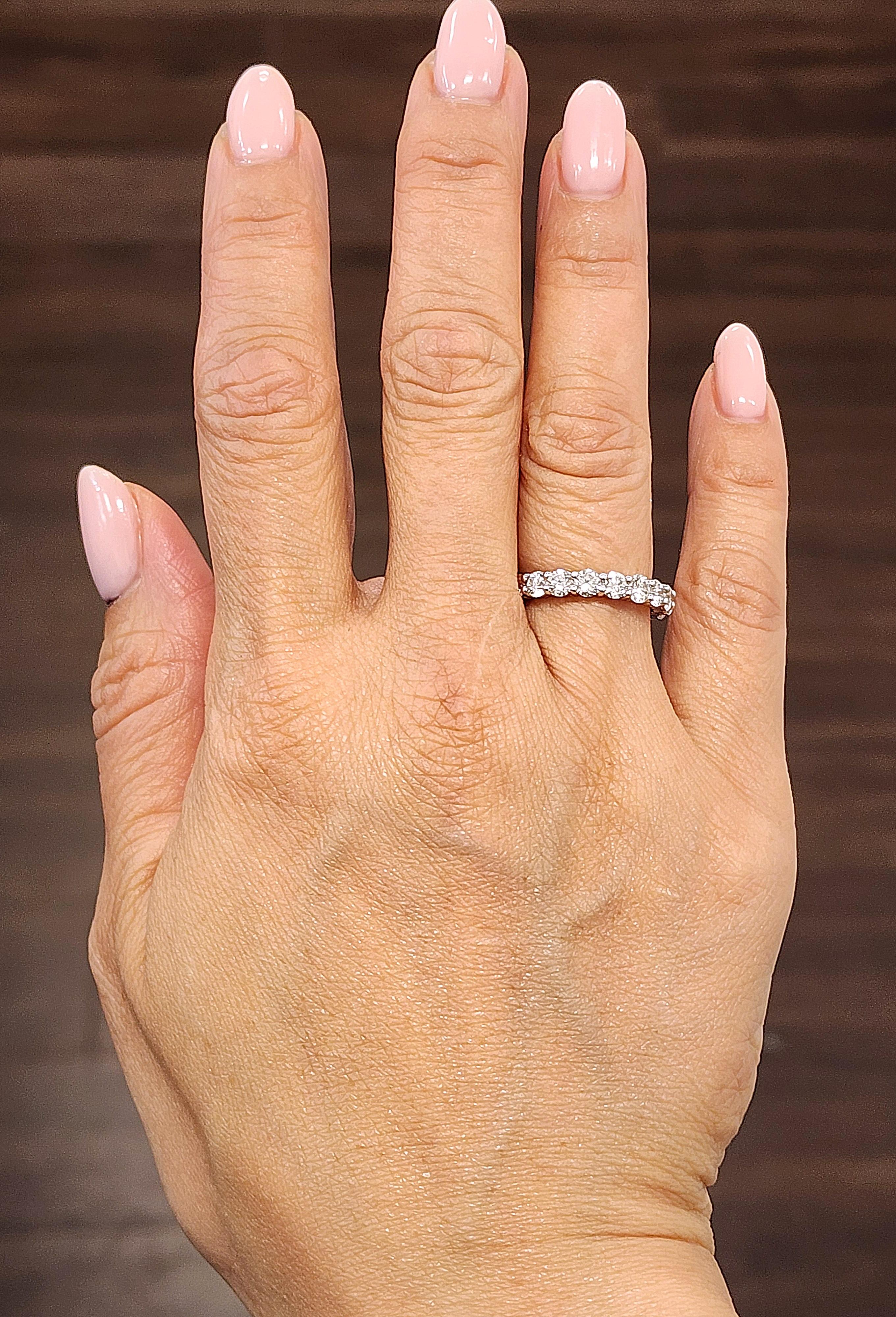 This gorgeous diamond eternity band features 19 round brilliant diamonds set in 14k white gold. The diamonds boast a color of G/H and VS2/SI1 in clarity. A beautiful ring to add to any wardrobe!