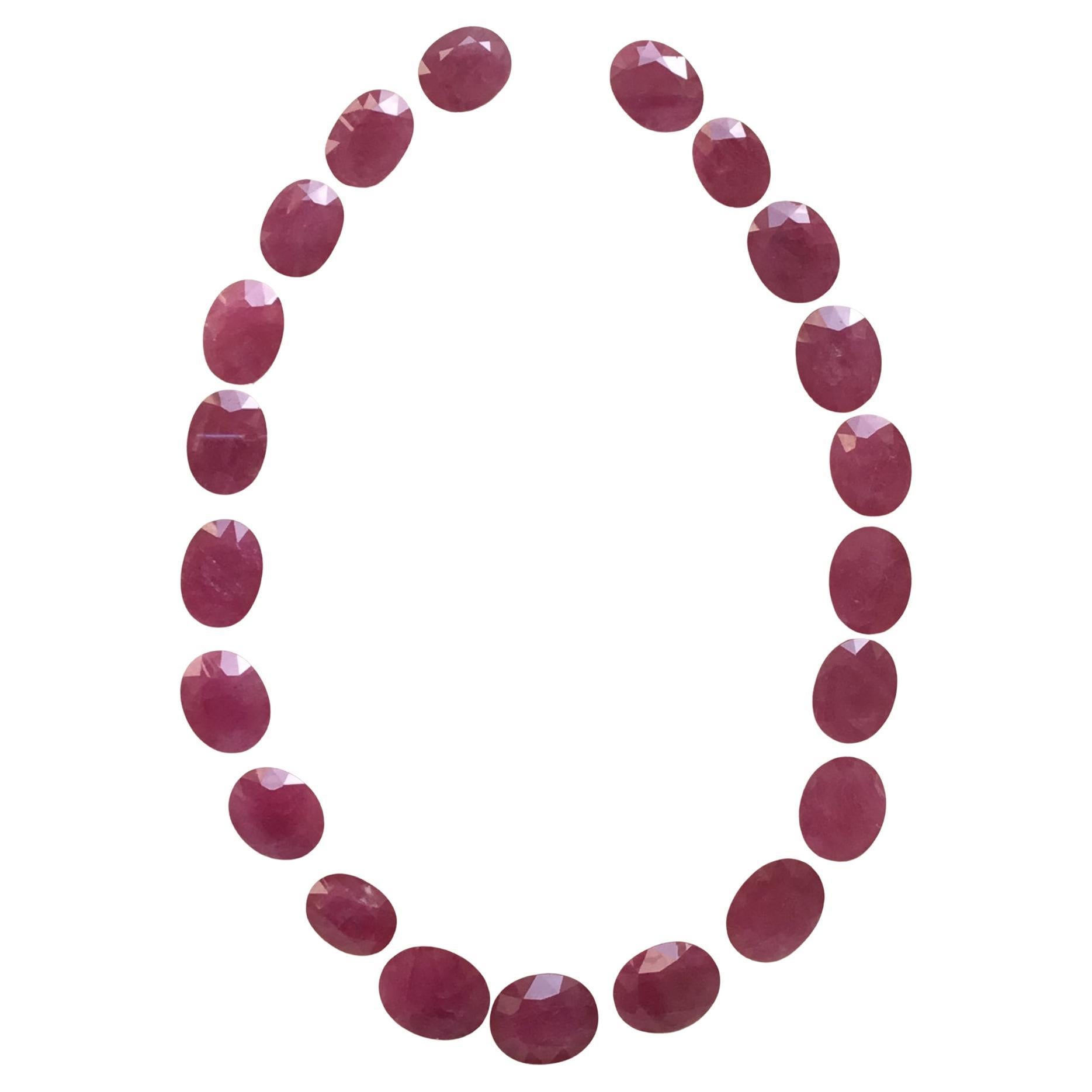 267.02 Carats Ruby Mozambique Oval Faceted Cut stone Layout Heated Natural Gem