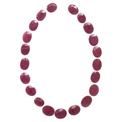 267.02 Carats Ruby Mozambique Oval Faceted Cut stone Layout Heated Natural Gem