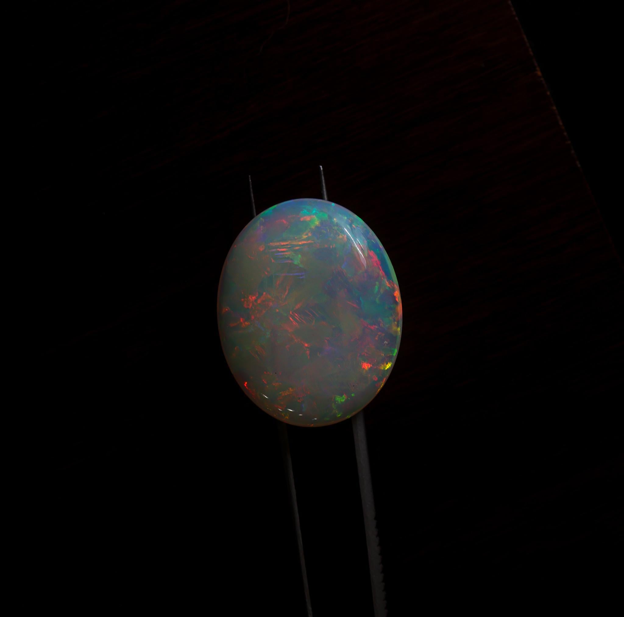 NNJ Designs presents a 26.72 carat Ethiopian Opal loose gemstone! Opals are celebrated for thier briliiant flashes of color and stunning patterns, often displaying a mesmerizing play of light that captivates gem enthusiasts worldwide. This Ethiopian