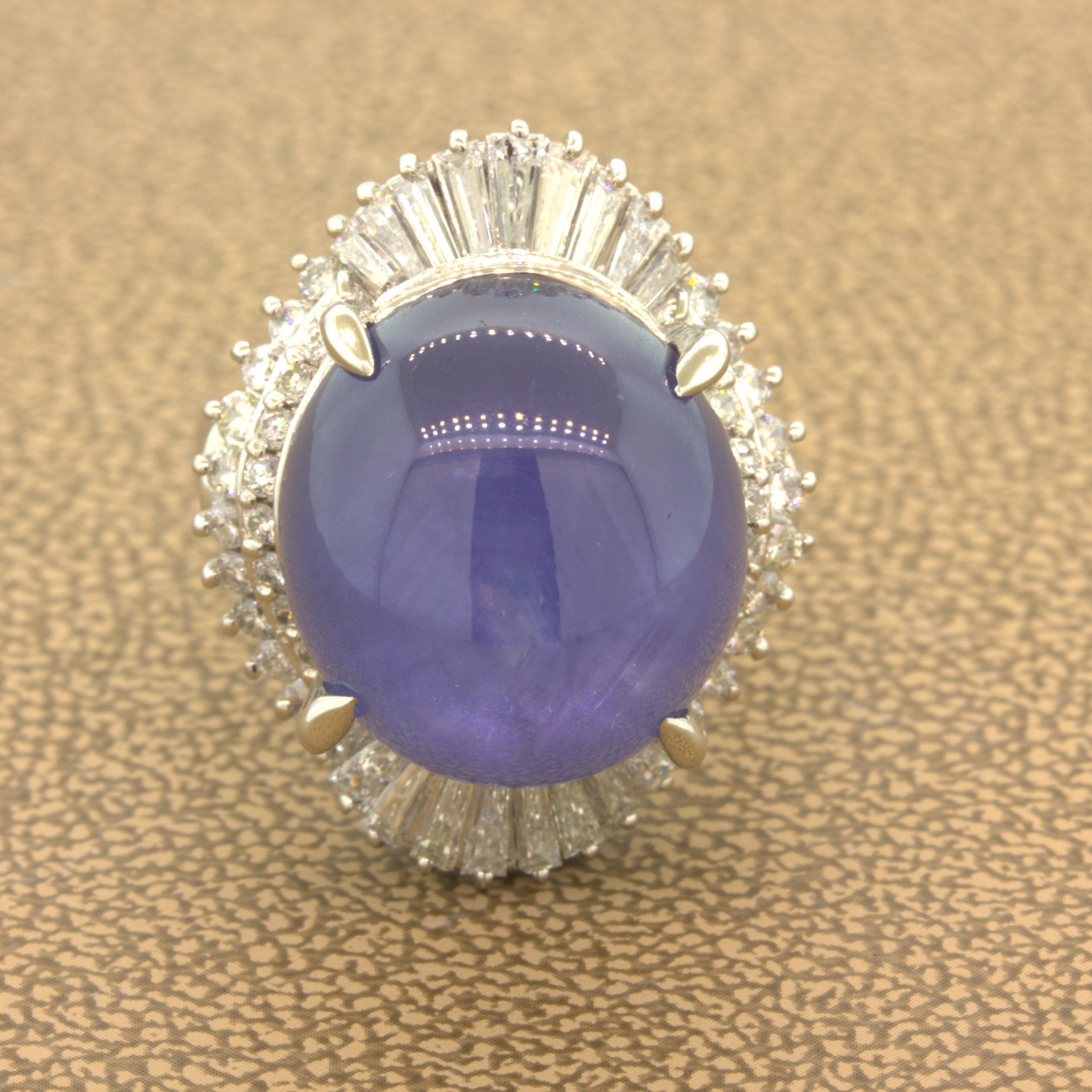 A large and impressive unheated star sapphire takes center stage! It weighs a very impressive 26.75 carats and has an even soft blue color that glows in the light. Adding to that, it has a strong 6-rayed star with long full legs which is perfectly