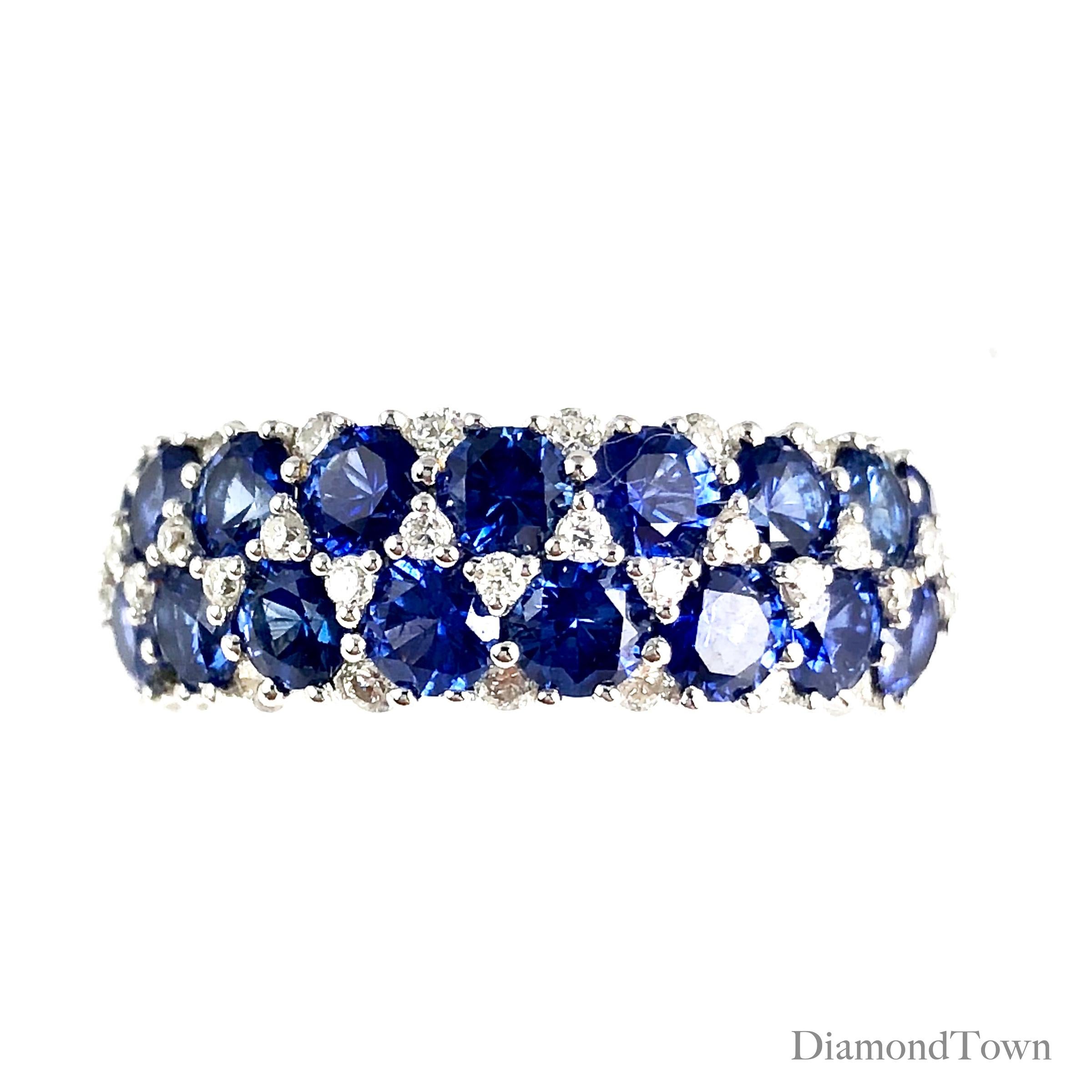 (DiamondTown) This gorgeous handcrafted ring features 17 round vivid blue sapphires tucked among 0.44 carats white diamonds. The layered design extends across the full width of the band.

This ring can be professionally sized to your specification,