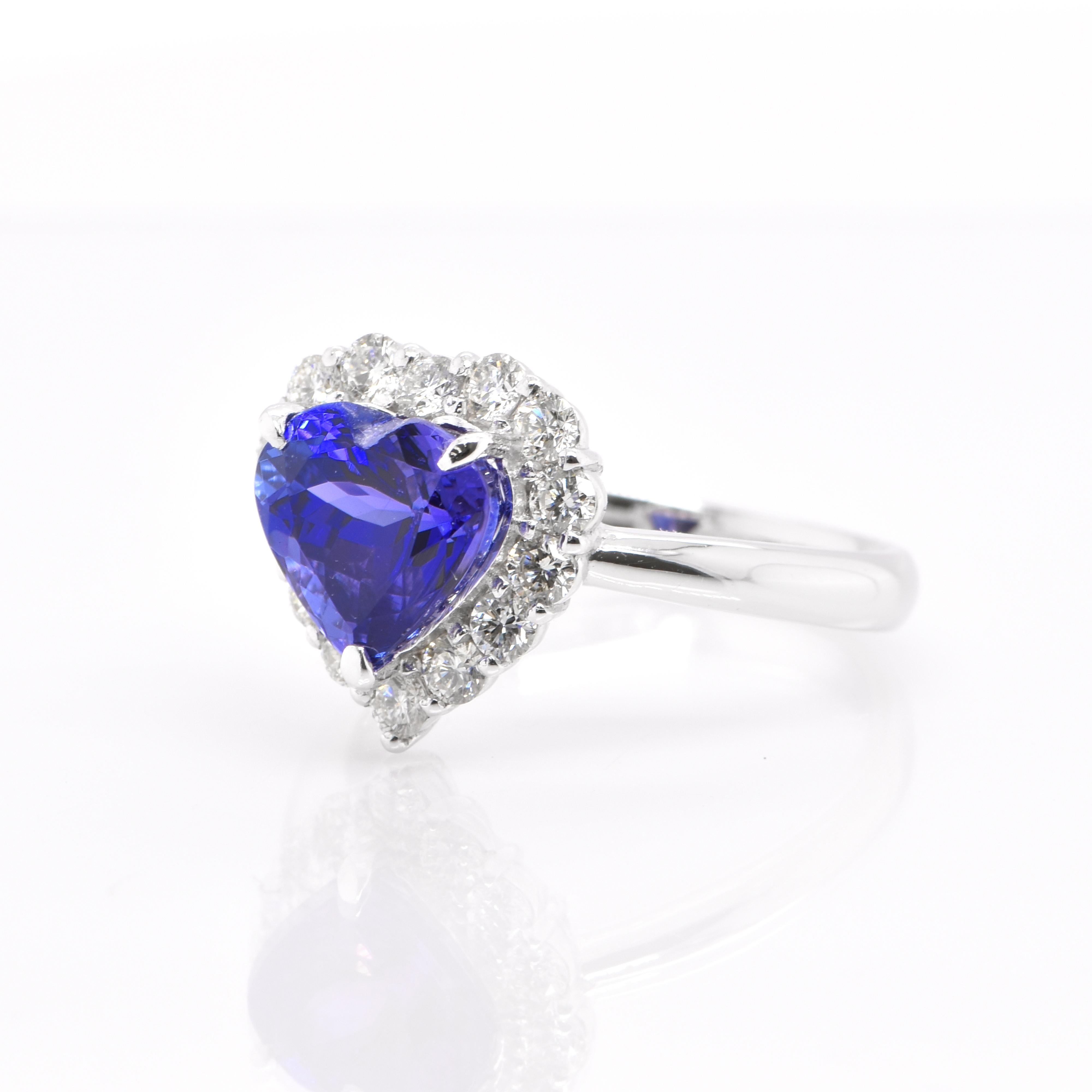 A beautiful Halo Ring inspired by the feature film Titanic, featuring a 2.68 Carat, Natural, Heart-Shape Tanzanite and 0.55 Carats of Diamond Accents set in Platinum. Tanzanite's name was given by Tiffany and Co after its only known source: