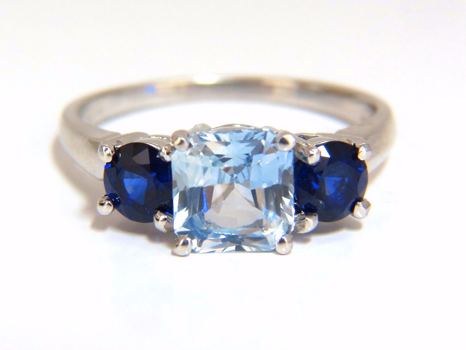 Ice Blue & Blues...

1.68ct. Natural light blue sapphire ring.

Ice Blue color

Clean clarity.

Square cut

6.8 X 6.5mm

Transparent, Vibrant light blue color

Side natural round sapphires: 1.00ct.

Royal Blue, clean clarity and transparent



14kt.