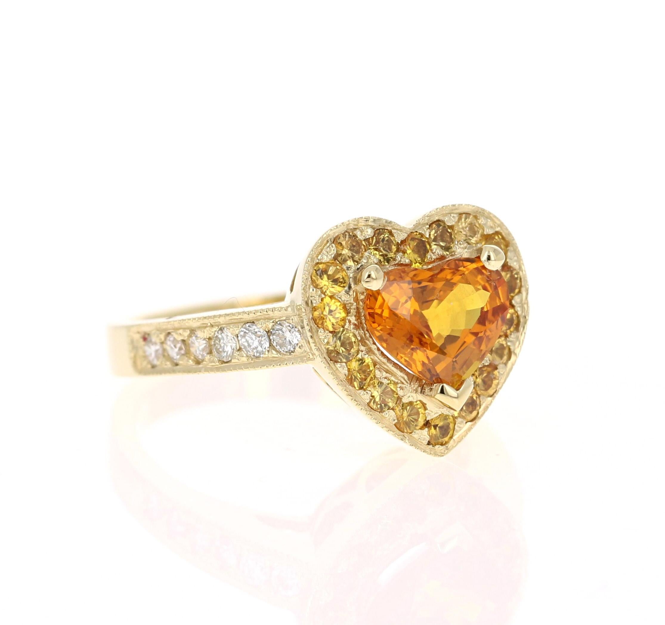 A gorgeous Orange Sapphire and Diamond Ring set in Yellow Gold. It can be the most beautiful and unique Engagement Ring. 

The Heart Cut Orange Sapphire is 1.79 Carats surrounded by a halo of 20 Yellow Sapphires weighing 0.59 Carats. The shank of