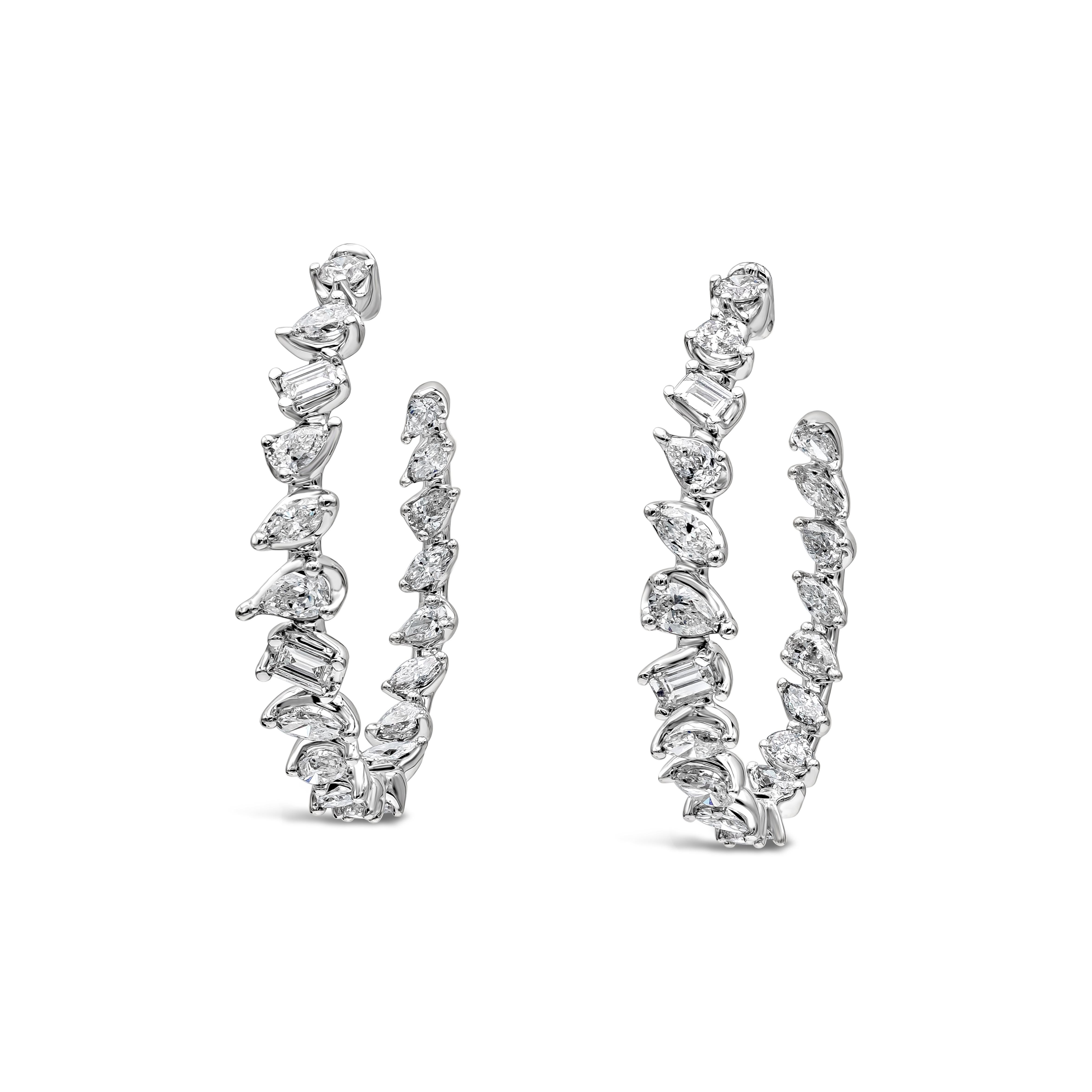A simple and versatile hoop earrings showcasing multiple shape diamonds weighing 2.68 carats total in G-H color and SI in clarity. Made in 18 karat white gold.

Roman Malakov is a custom house, specializing in creating anything you can imagine. If