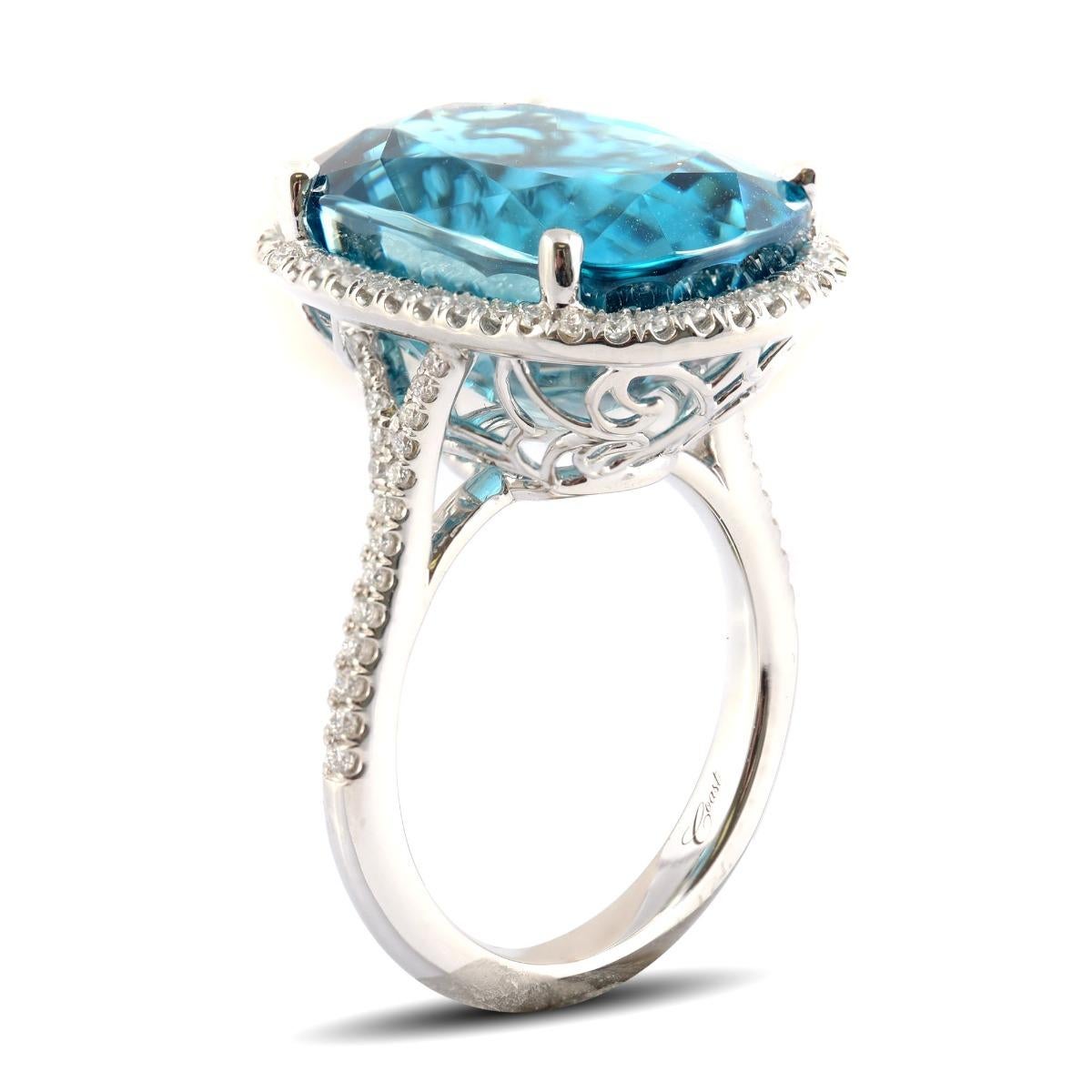 Zircons are known to heal and calm the mind, and this majestic and electric blue Zircon ring makes a statement in itself. Weighing 26.88 carats, the center stone that has been cut to perfection and is free from eye visible inclusions. A piece that