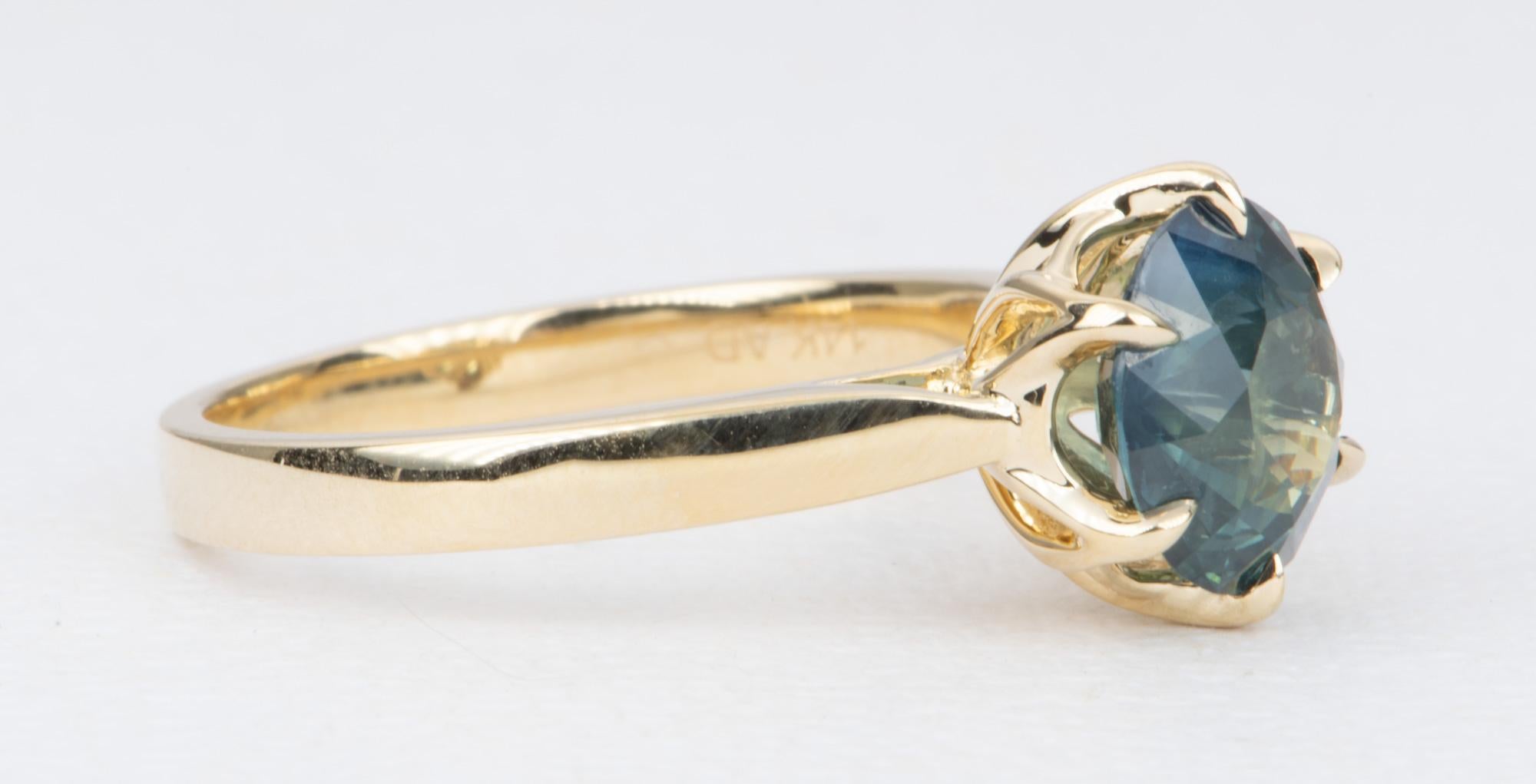 ♥  Solid 14K gold ring set with a beautiful round brilliant cut sapphire in the center
♥  Set in a 6-prong tulip style setting
♥  The sapphire is a green blue sapphire, meaning it is predominantly blue with a green undertone. The studio photos were