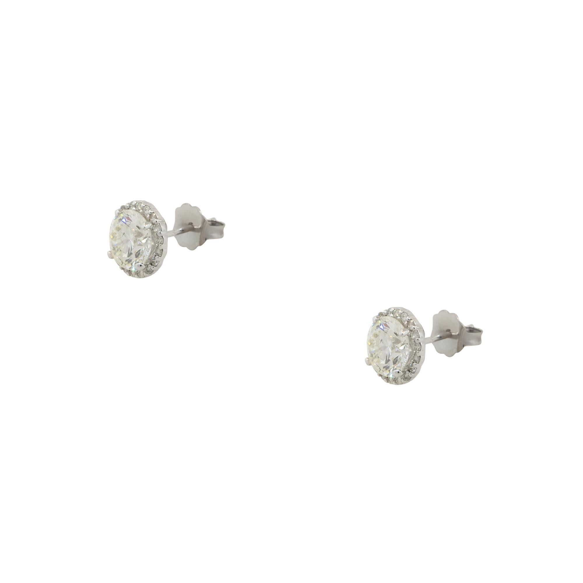 Material: 14k White Gold
Diamond Details: Main Diamonds are Approx. 2.44ctw. Halo Diamonds are approx. 0.25ctw. Diamonds are H/I in color and SI in clarity
Earring Backs: Friction Backs
Weight: 1.2dwt
Additional Details: This item comes with a