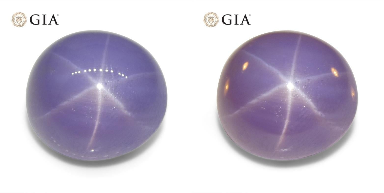 This is a stunning GIA Certified Star Sapphire

The GIA report reads as follows:

GIA Report Number: 2233023940
Shape: Oval
Cutting Style: Double Cabochon
Cutting Style: Crown: 
Cutting Style: Pavilion: 
Transparency: Translucent
Colour: Violetish