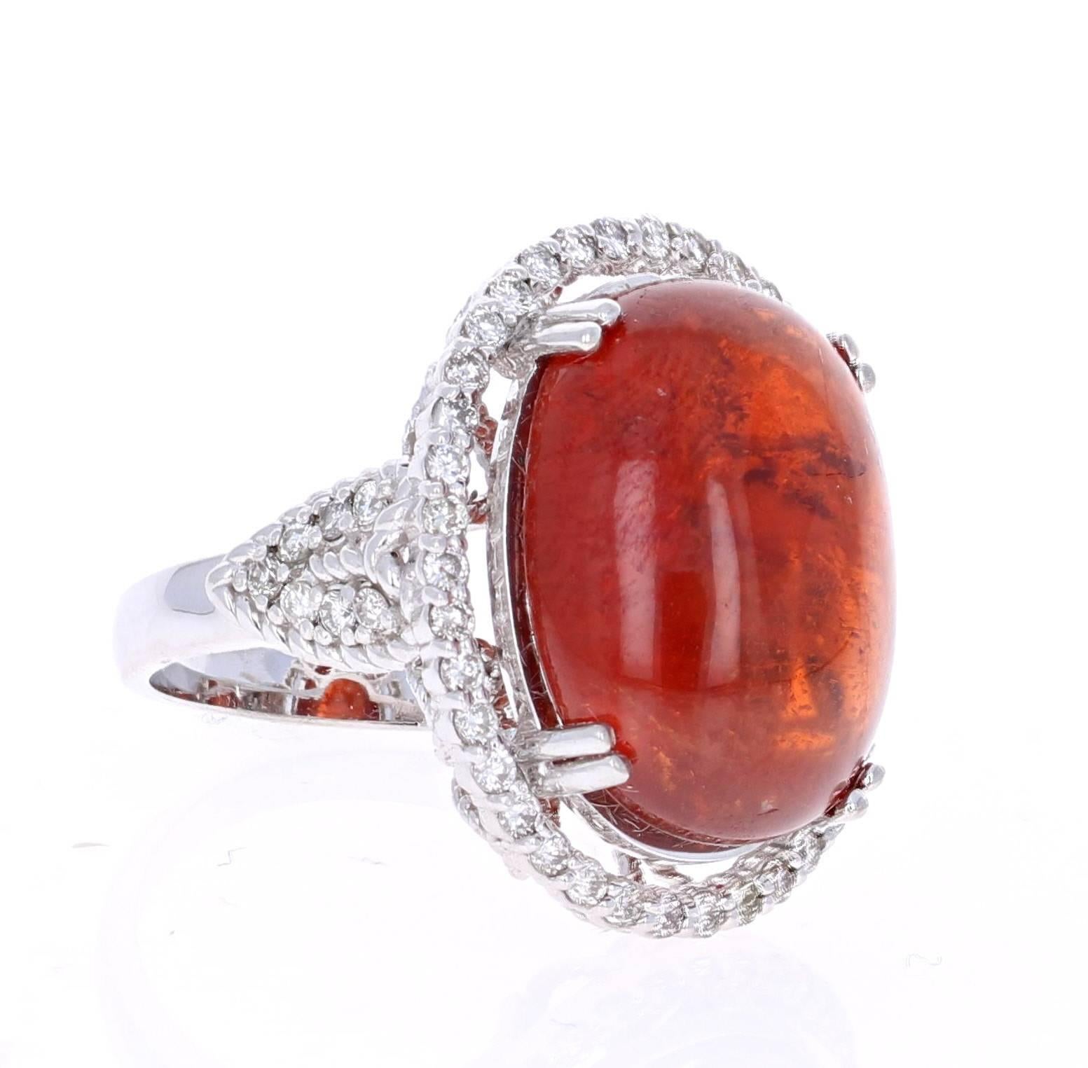 26.97 Carat Cabochon Spessartite Diamond White Gold Cocktail Ring!
This beautiful ring has a huge 26.12 carat Cabochon Spessartite set in the center of the ring. A Spessartite is a natural stone that is actually a part of the Garnet family of