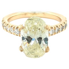 2.69ct Oval Cut Diamond Set in 14kt Yellow Gold Ring with 0.50ct Side Diamonds