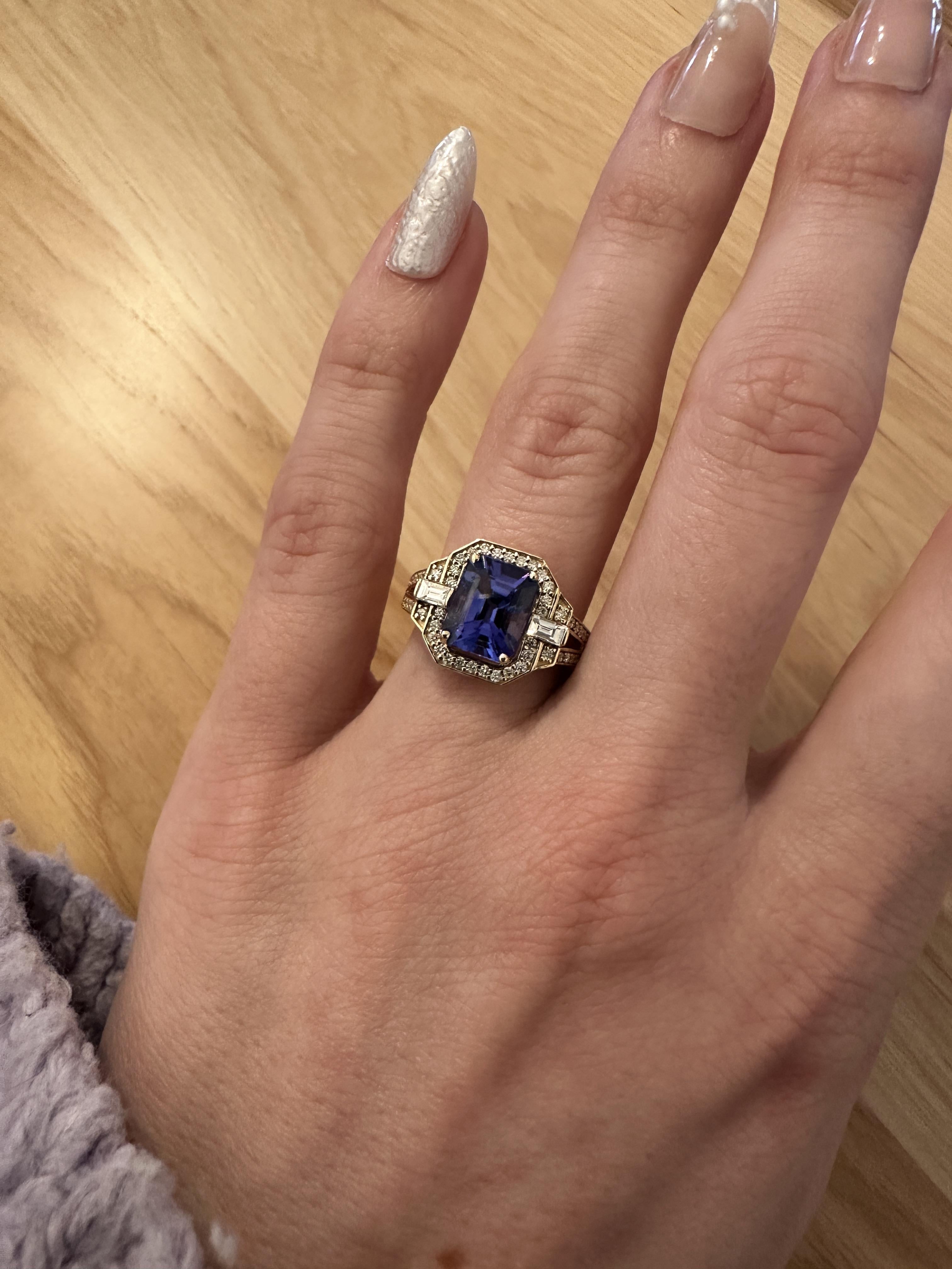 This exquisite statement ring showcases a stunning 2.60 carat Tanzanite with natural earth mined diamonds, all set in solid 14K gold. This Tanzanite ring makes a beautiful December birthstone gift for your loved ones!

**We offer complimentary